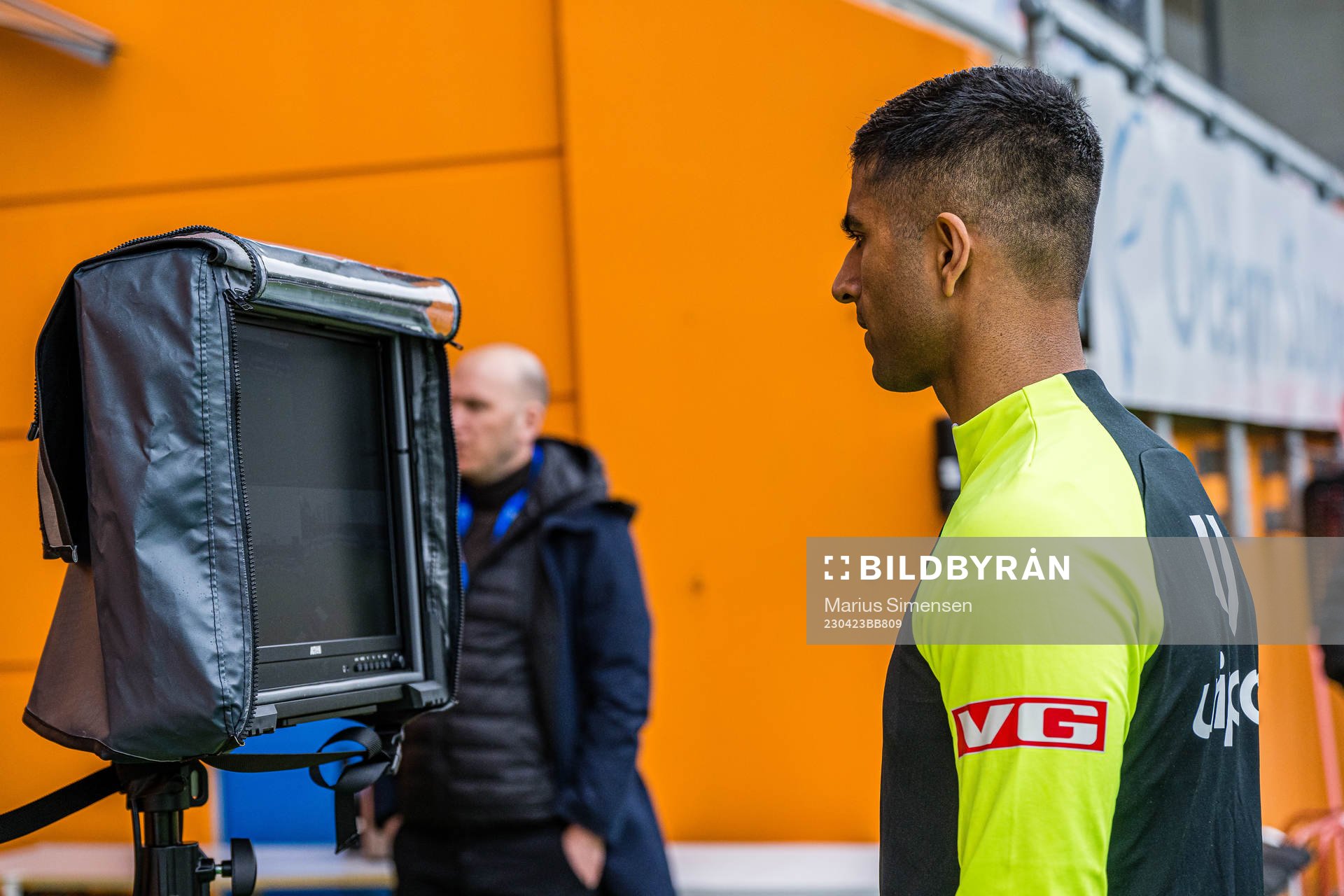 Mohammad Usman Aslam, referee, checking the VAR screen