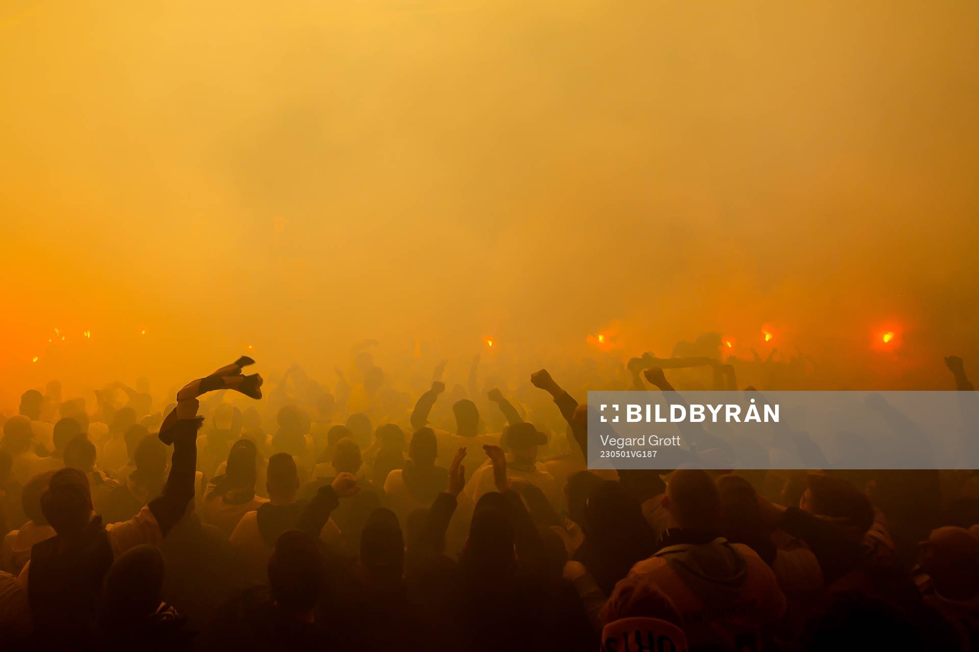 Fans of Lillestrøm celebrate with pyro