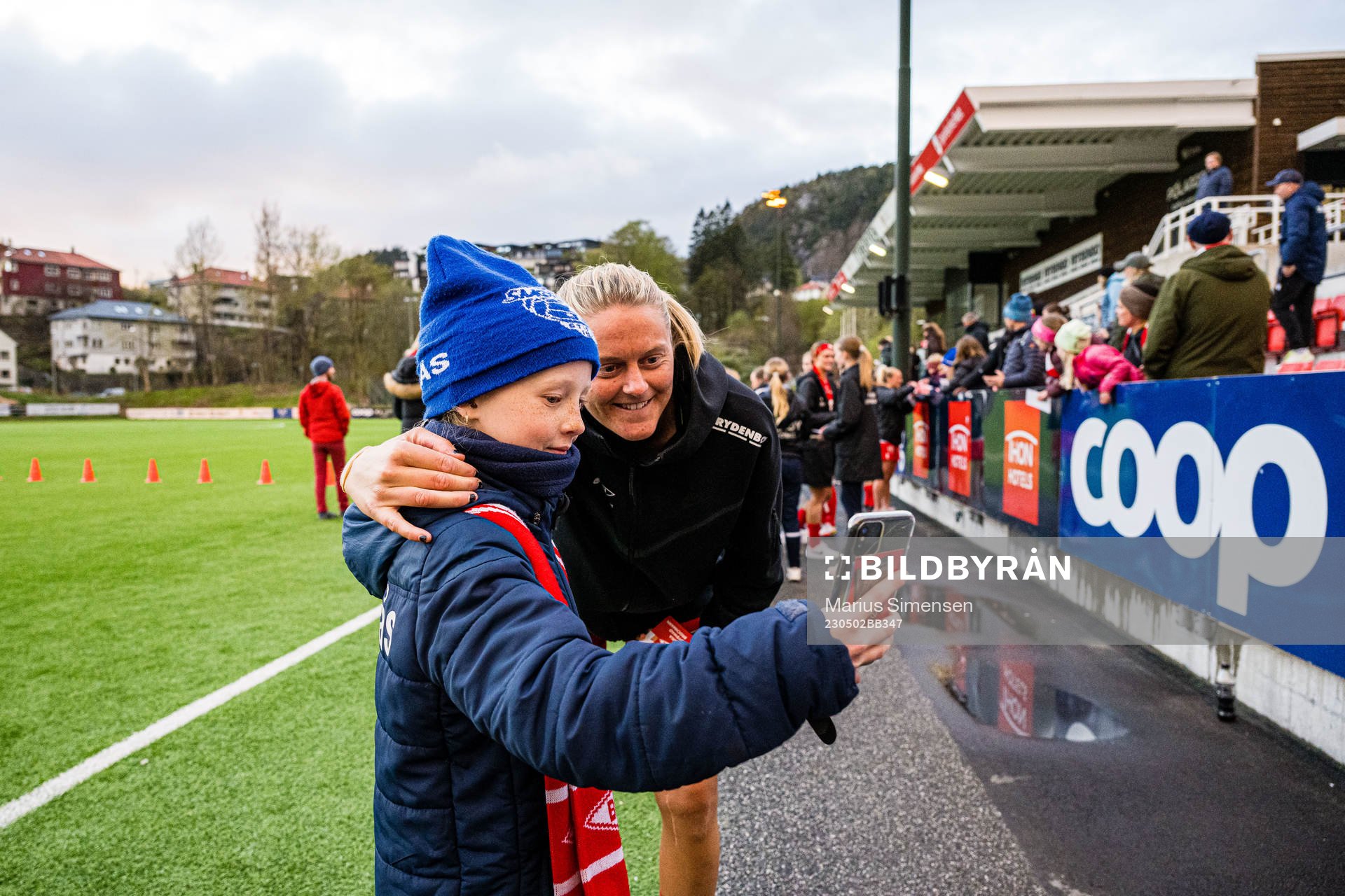 Maria Dybwad Brochmann of Brann taking a selfie with a fan