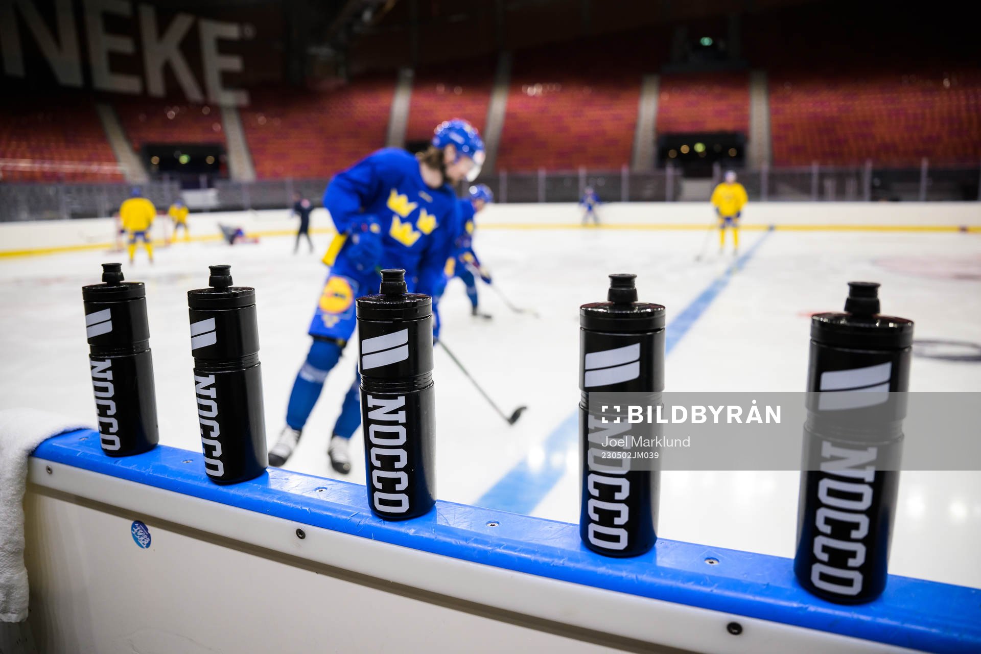 Nocco water bottles at rinkside at a practice session of