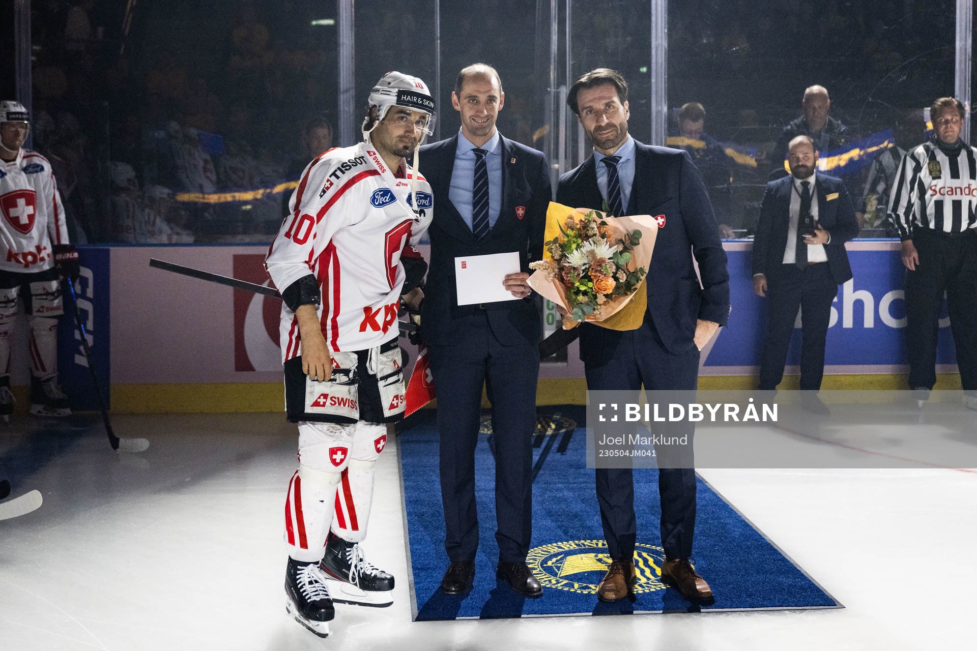 Andres Ambühl of Switzerland receives an award