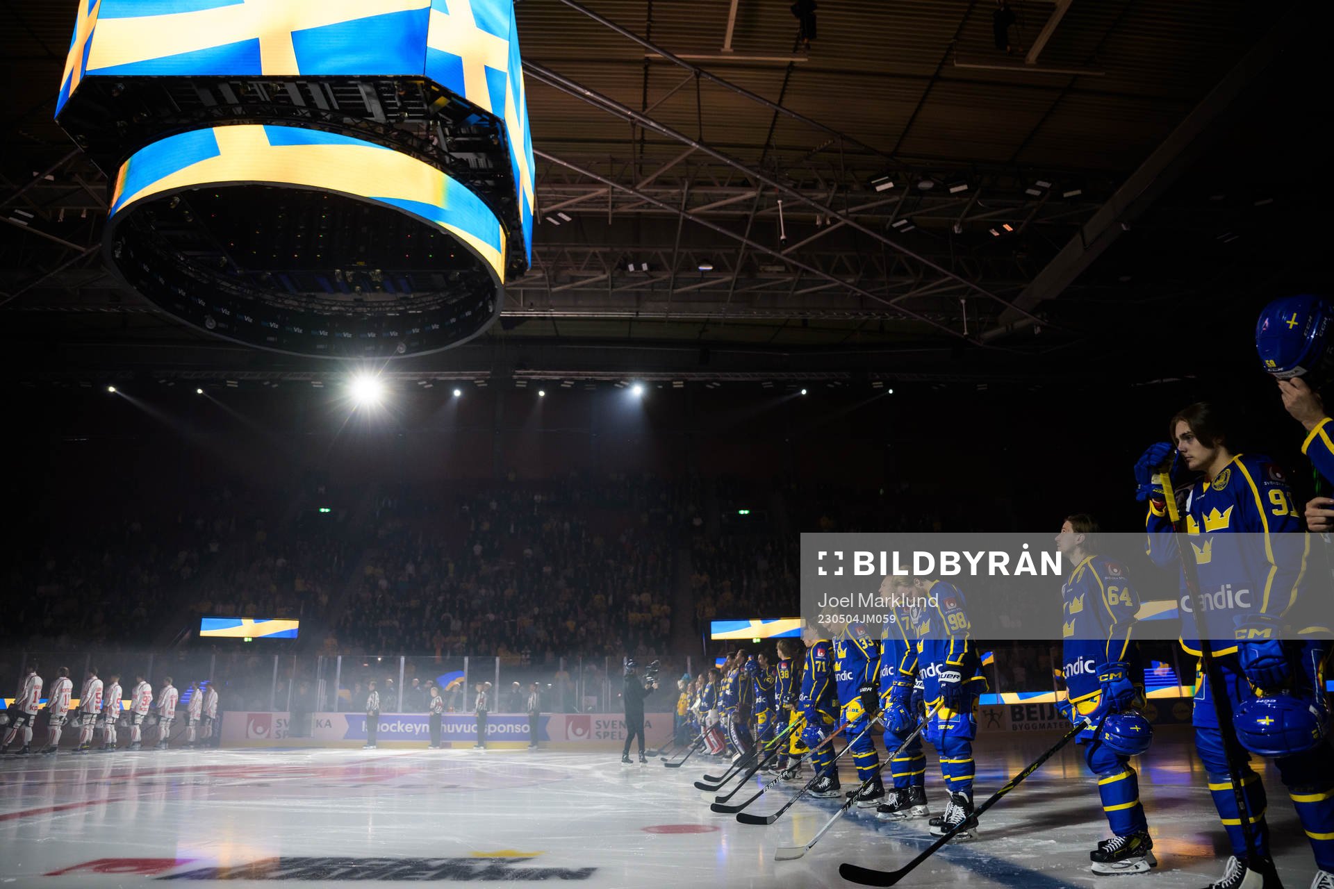 Players of Sweden are lined up for the national anthem