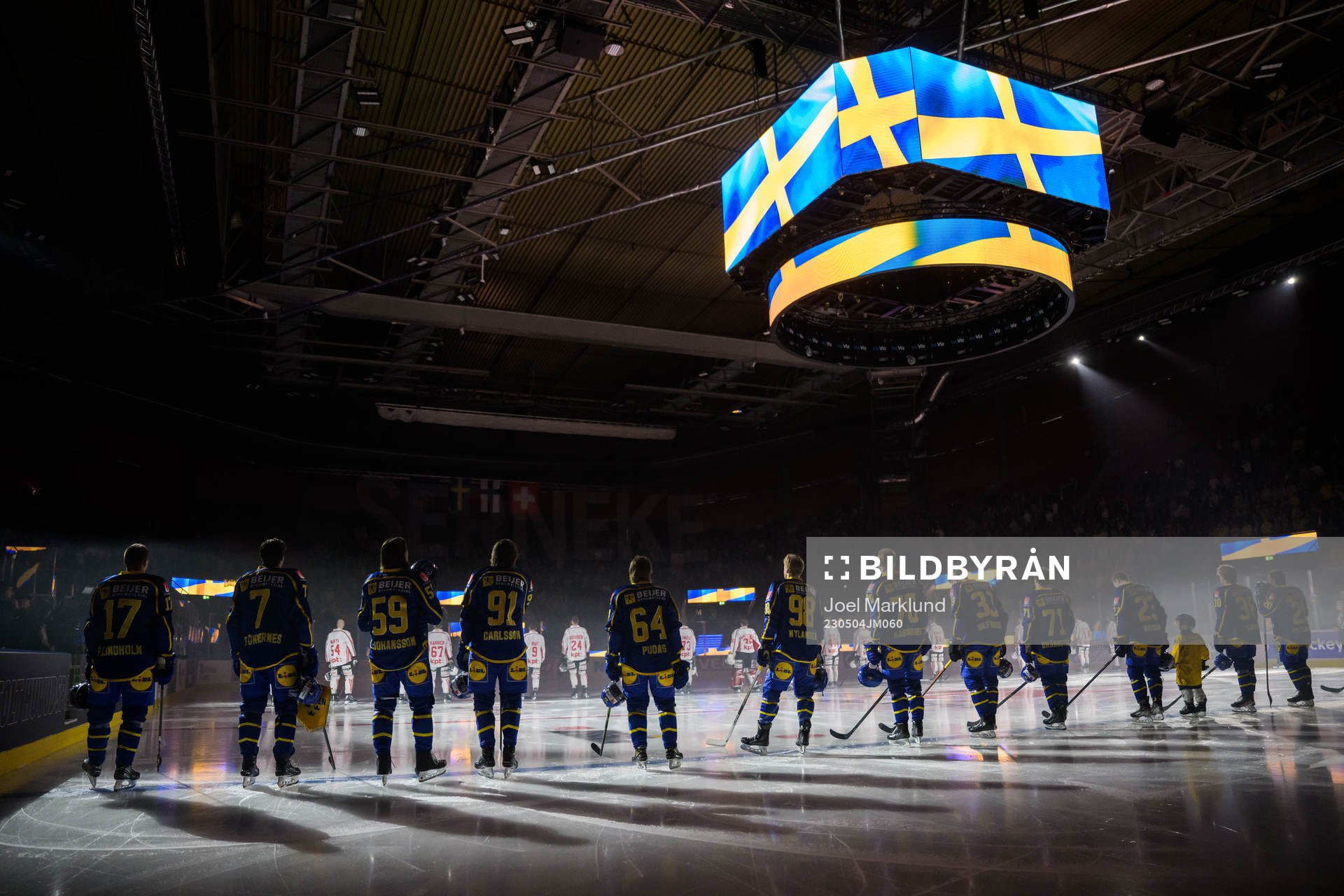 Players of Sweden are lined up for the national anthem