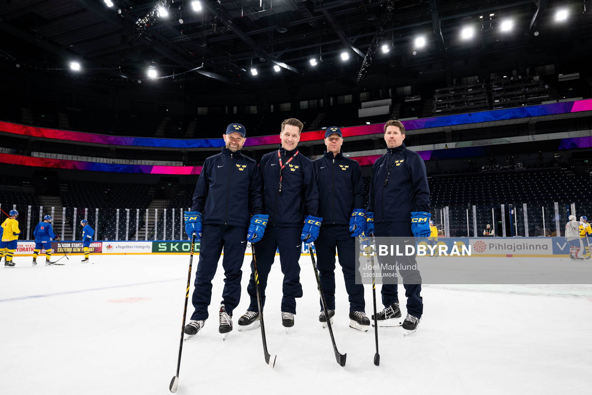 Goaltender coach Stefan Ladhe, head coach Sam Hallam,