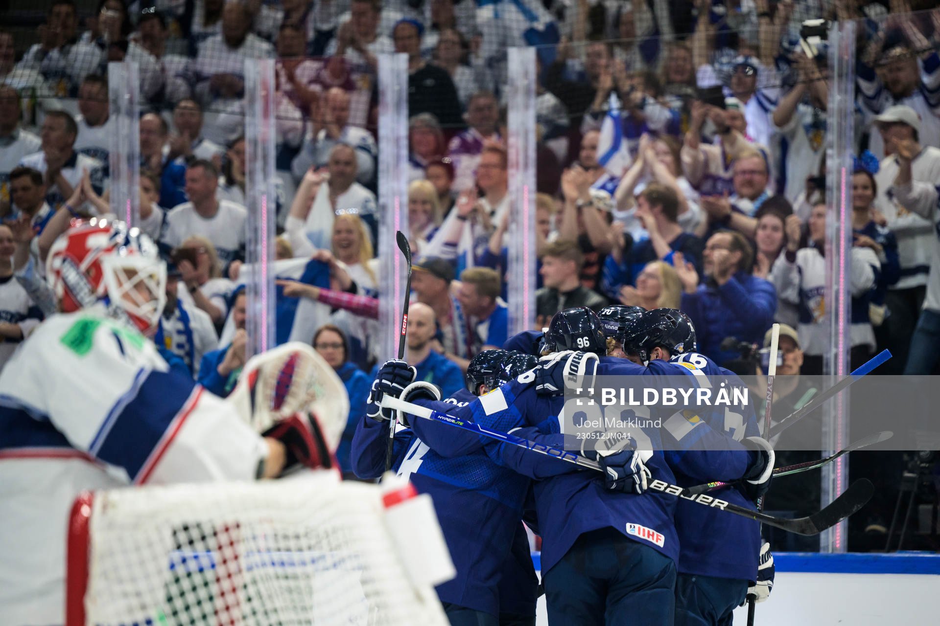 Teemu Hartikainen of Finland celebrates with teammates