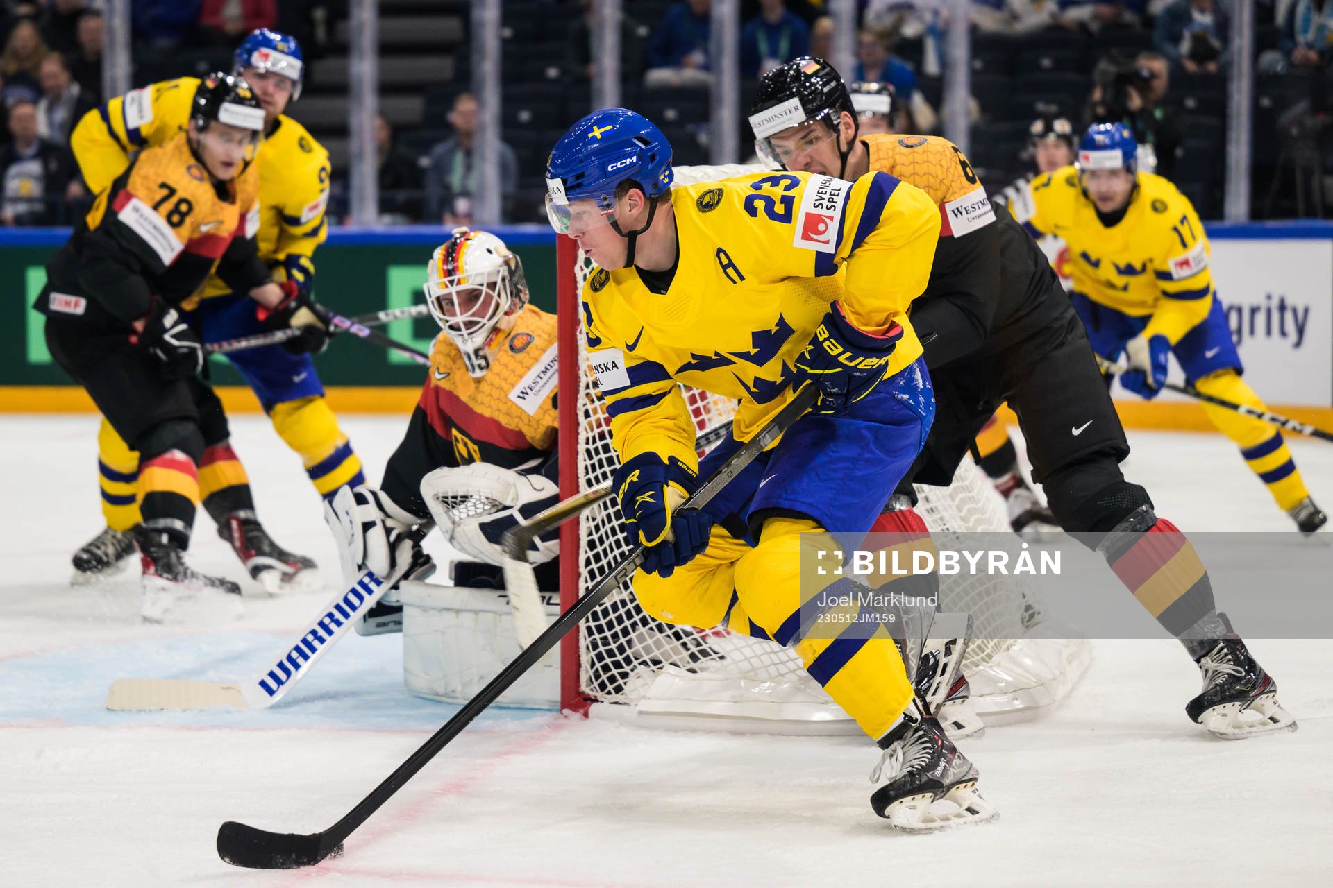 Lucas Raymond of Sweden challenges goaltender Mathias