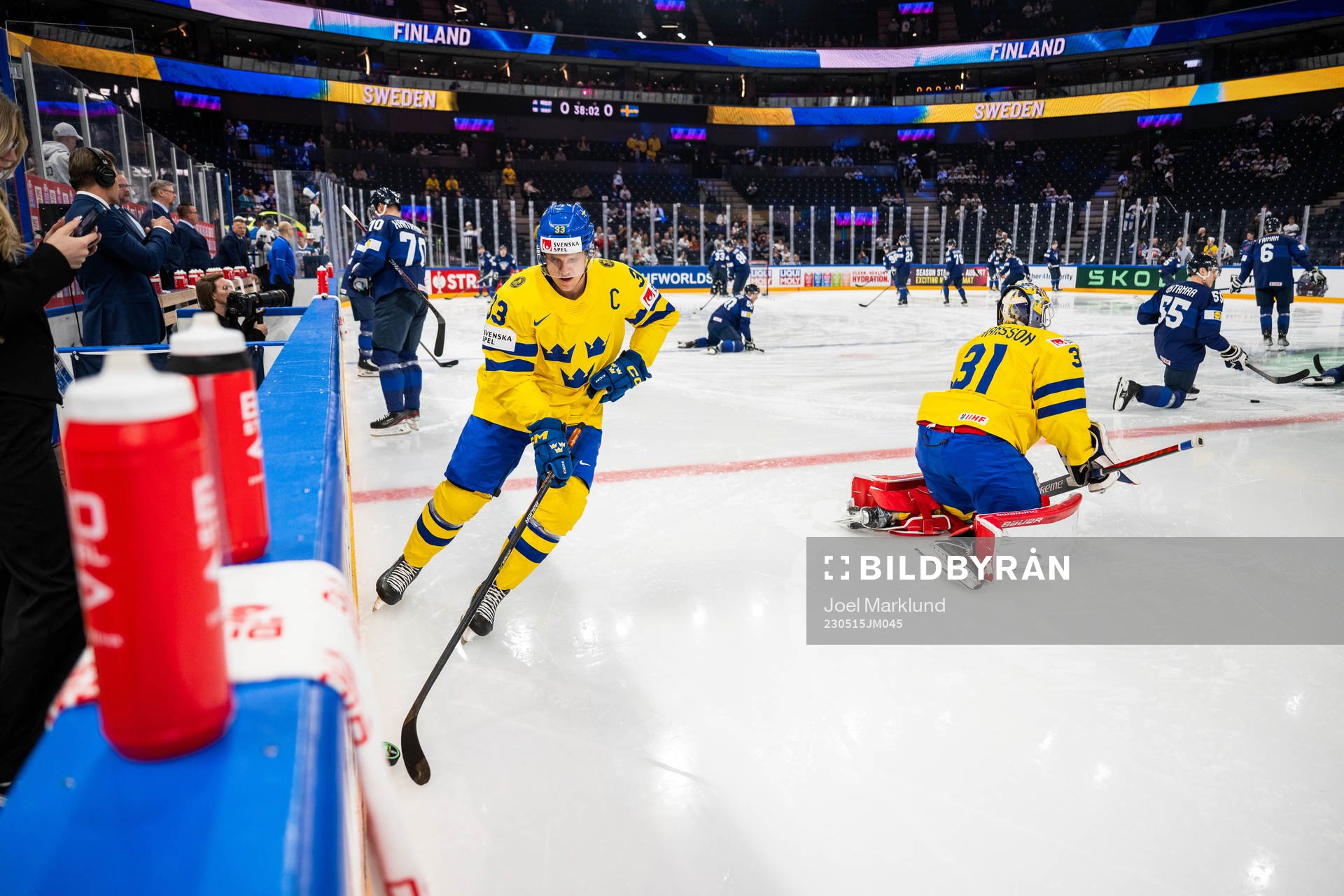 Jakob Silfverberg and goaltender Lars Johansson of Sweden