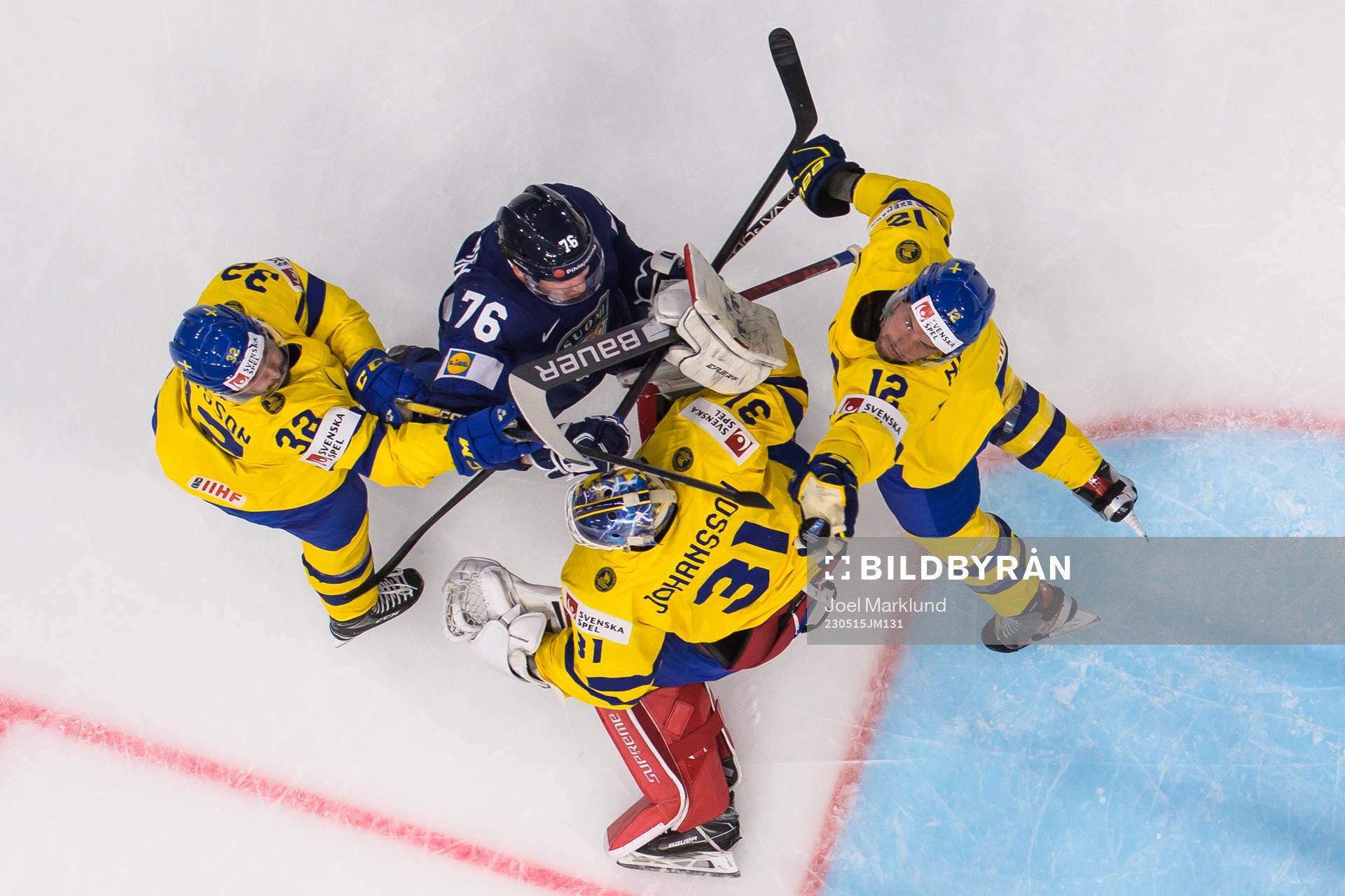 Jere Sallinen of Finland challenges Lukas Bengtsson,