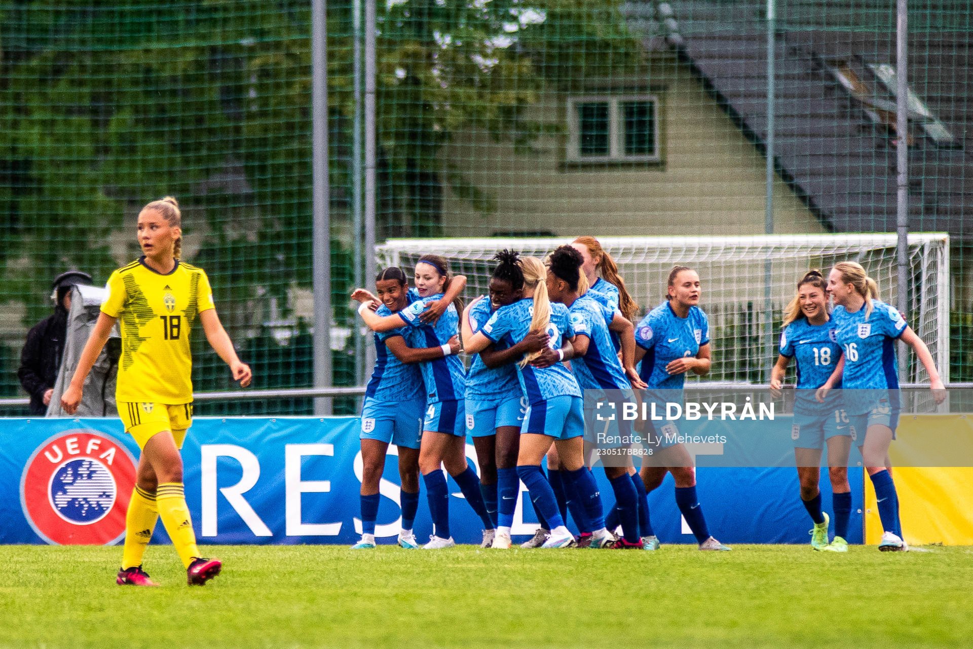 Players of England celebrate as Novalie Jensen of Sweden