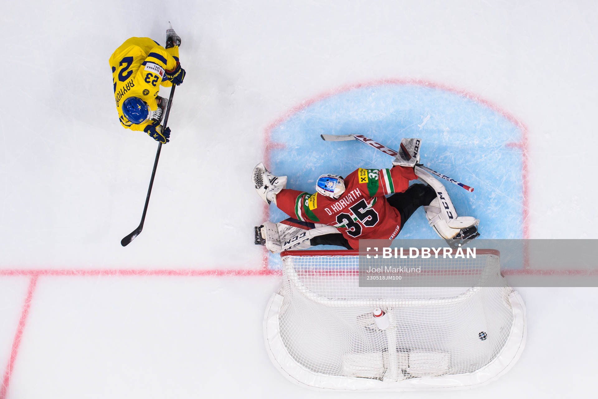 Lucas Raymond of Sweden scores 1-7 behind goaltender