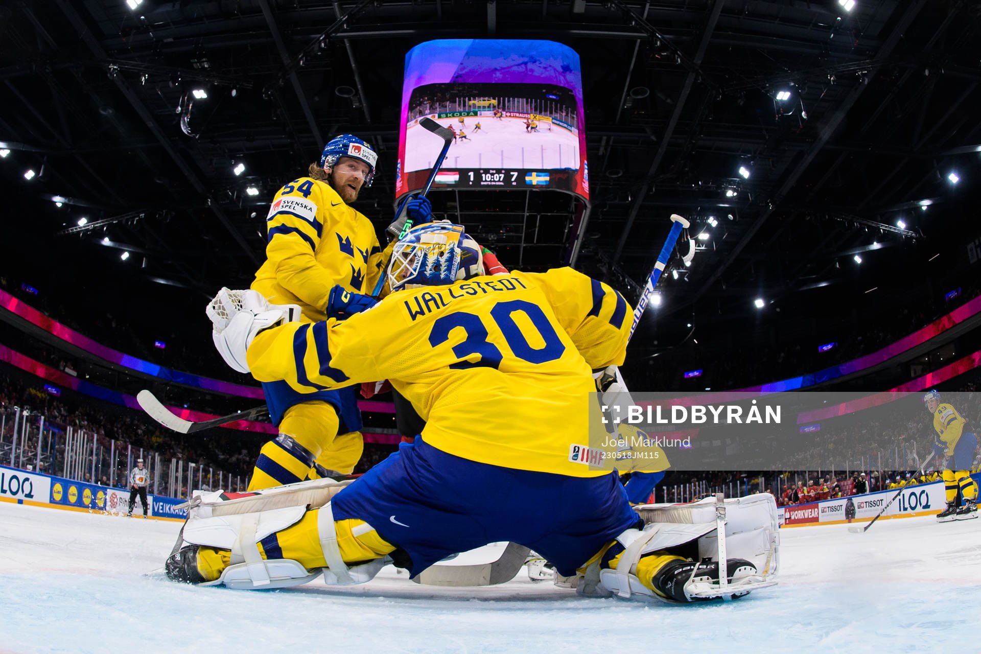 Anton Lindholm and goaltender Jesper Wallstedt of Sweden