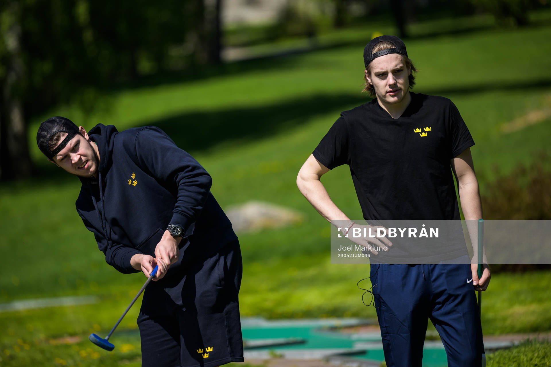 Goaltender Jesper Wallstedt and Leo Carlsson of Sweden play