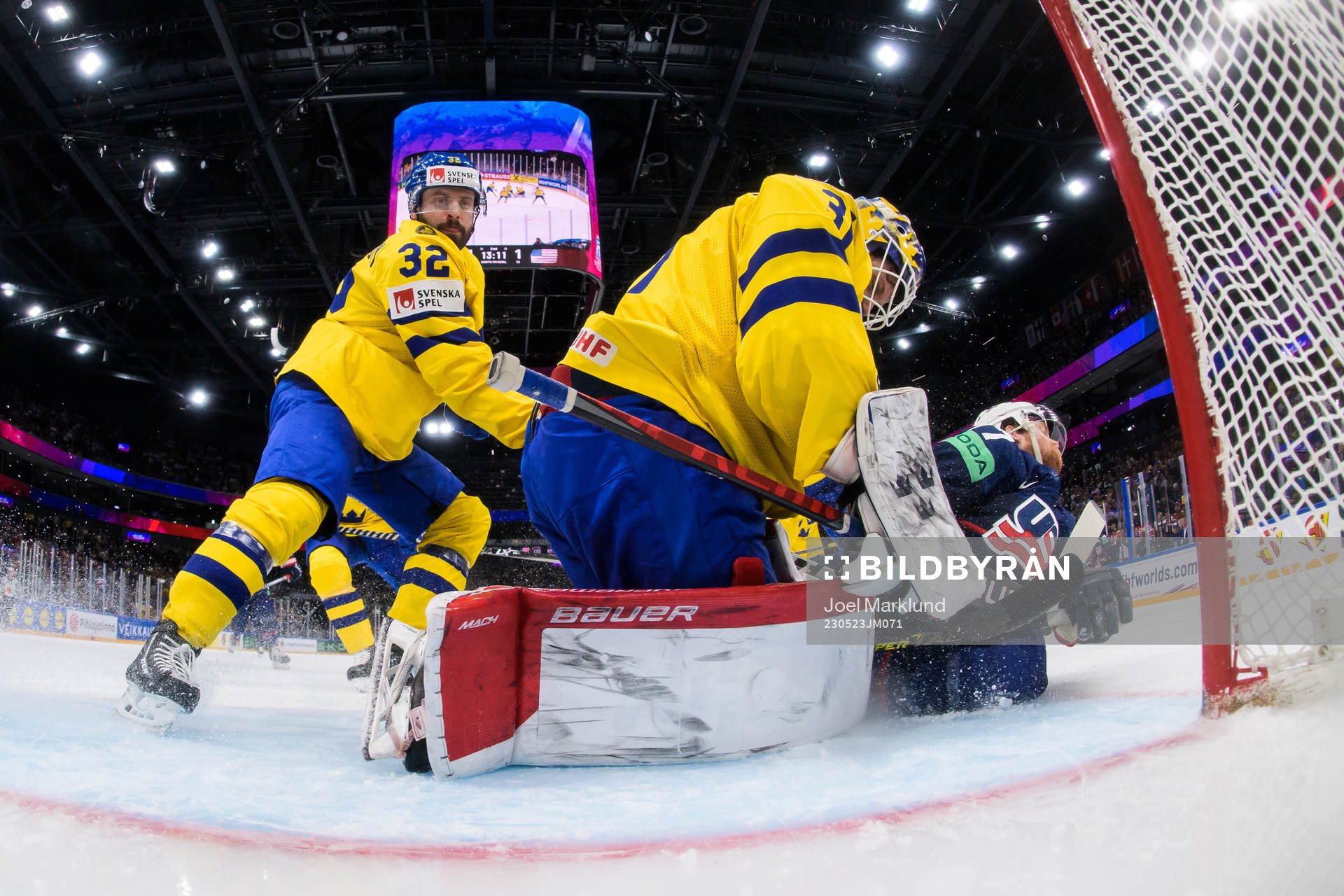 Lukas Bengtsson and goaltender Lars Johansson of Sweden are