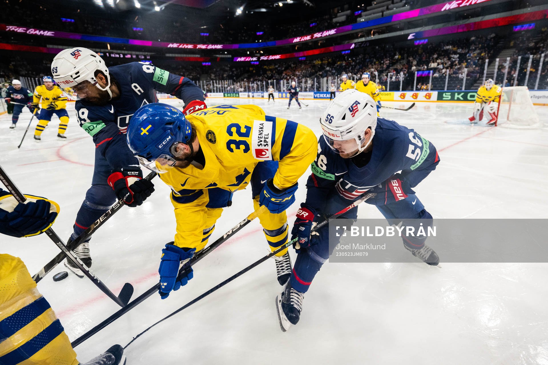 Alex Tuch and Rocco Grimaldi of USA against Lukas Bengtsson