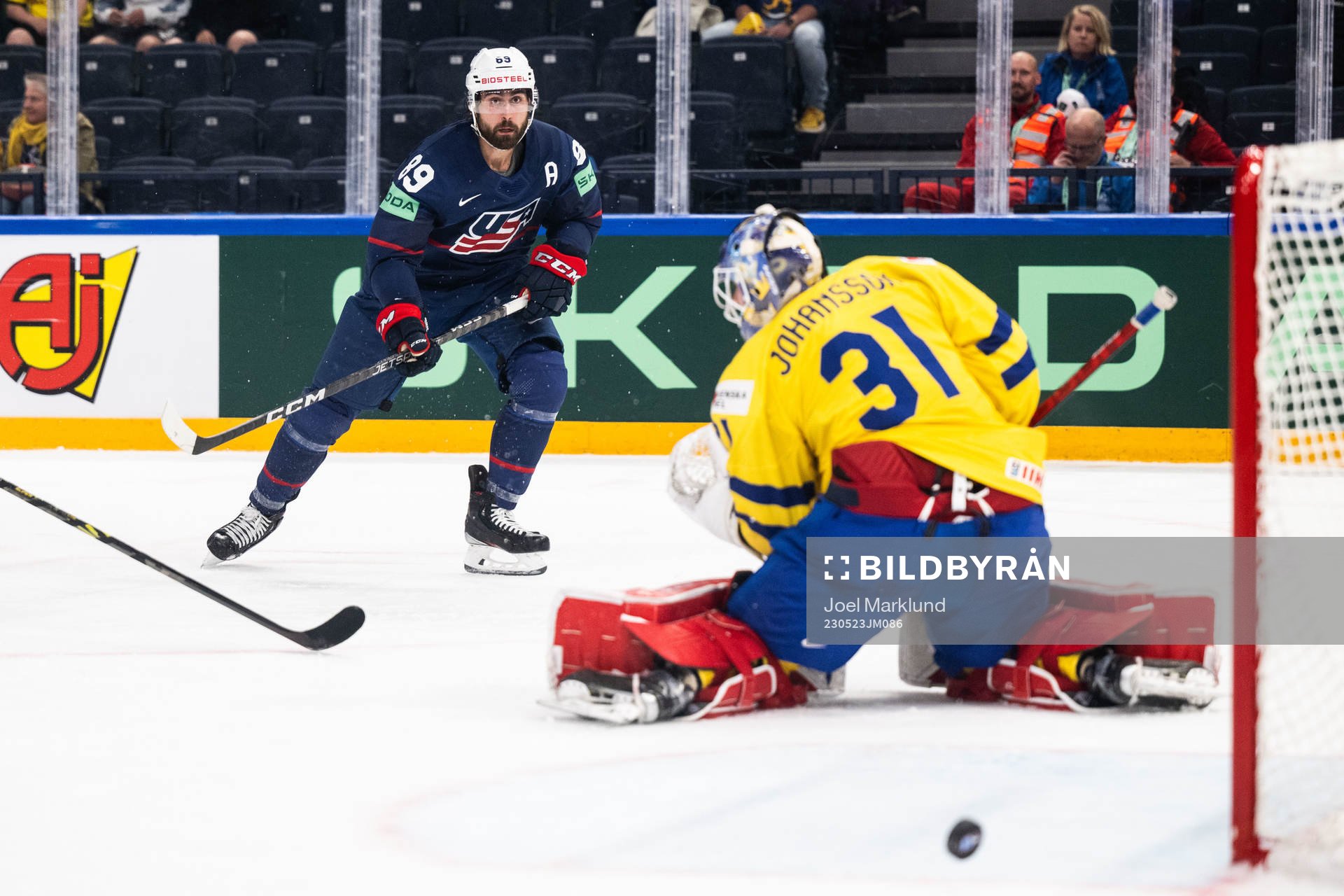 Alex Tuch of USA against goaltender Lars Johansson of Sweden