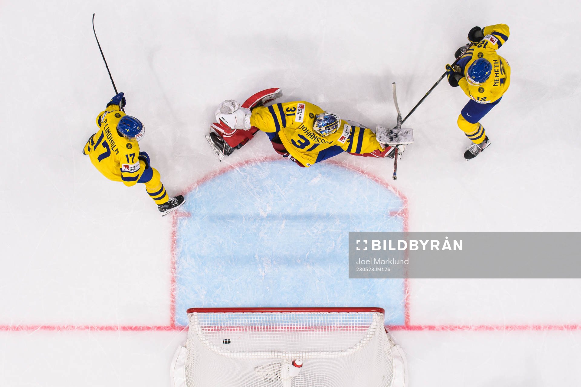 Pär Lindholm, goaltender Lars Johansson and Patrik Nemeth