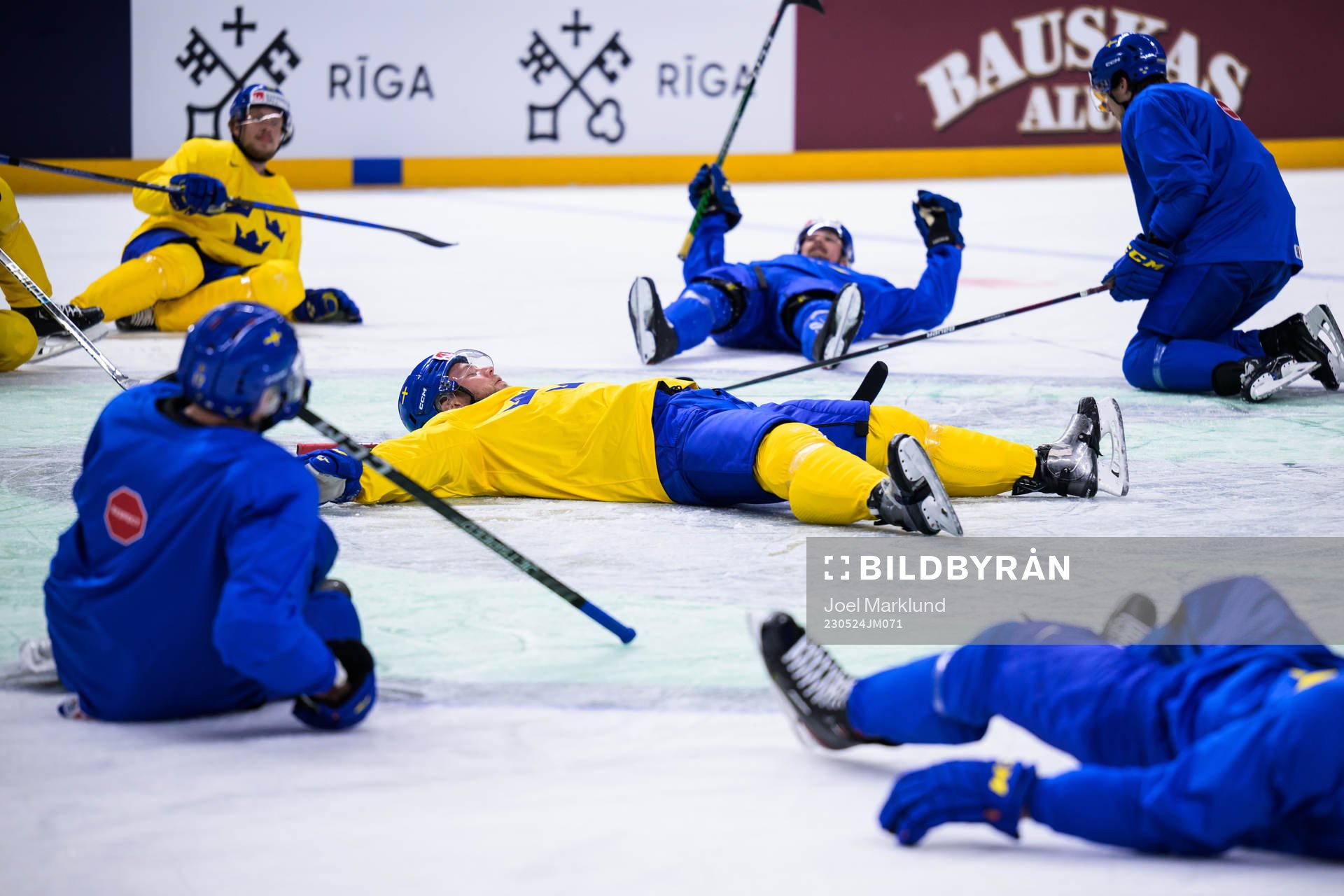 Christian Folin of Sweden leads a stretching exercise at a