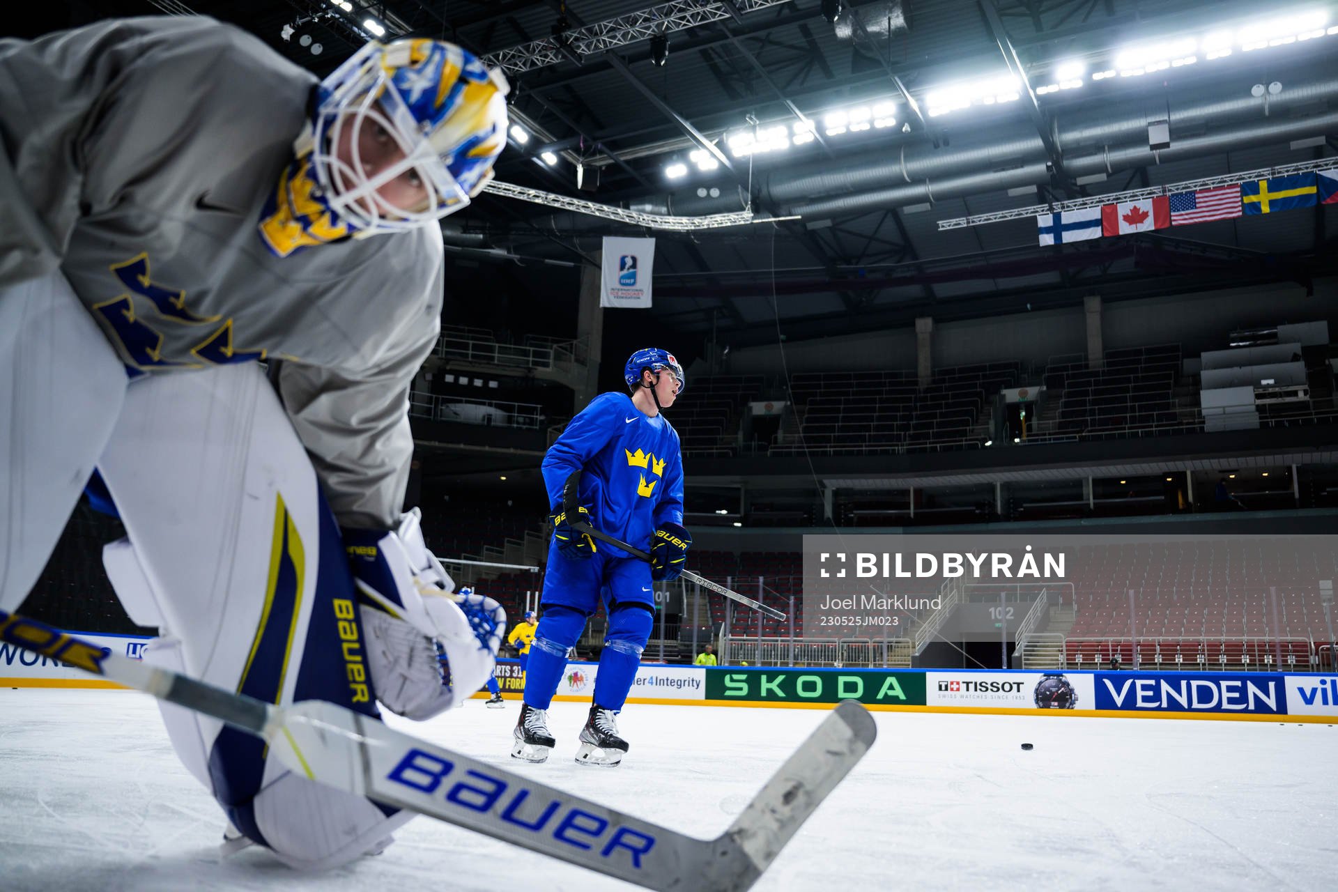 Goaltender Jesper Wallstedt and Lucas Raymond of Sweden at