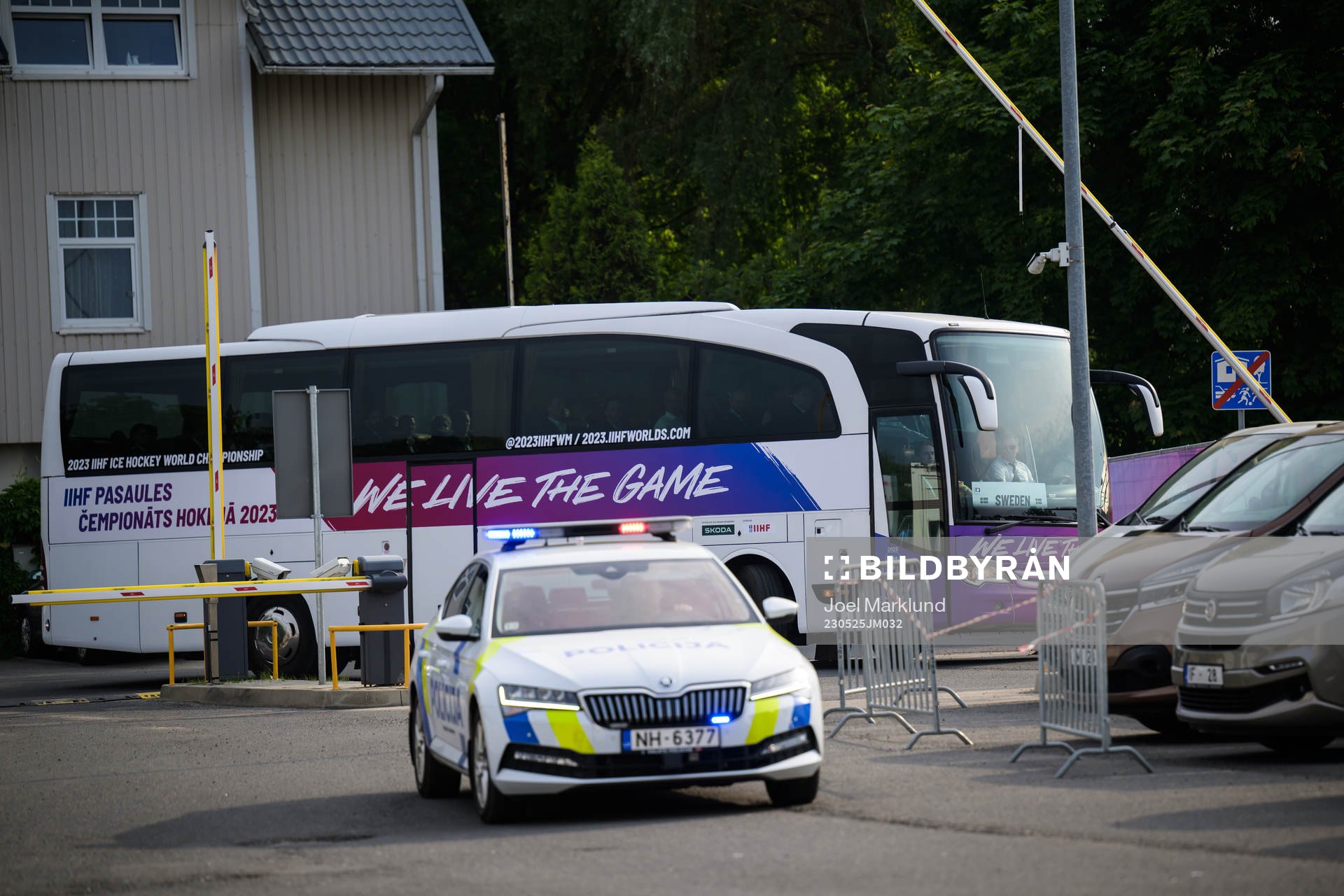 The team bus of Sweden arrives to the arena with a police