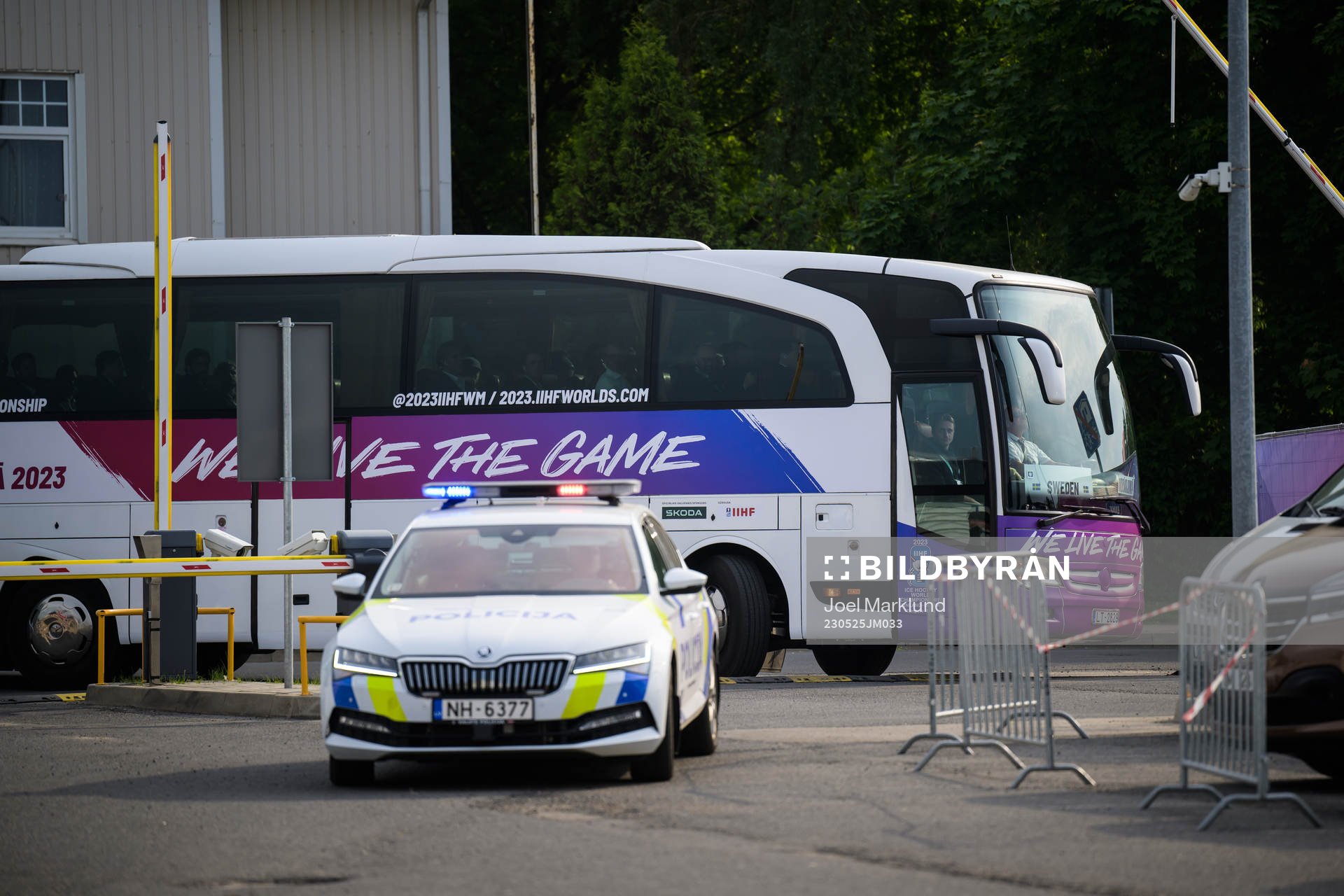 The team bus of Sweden arrives to the arena with a police