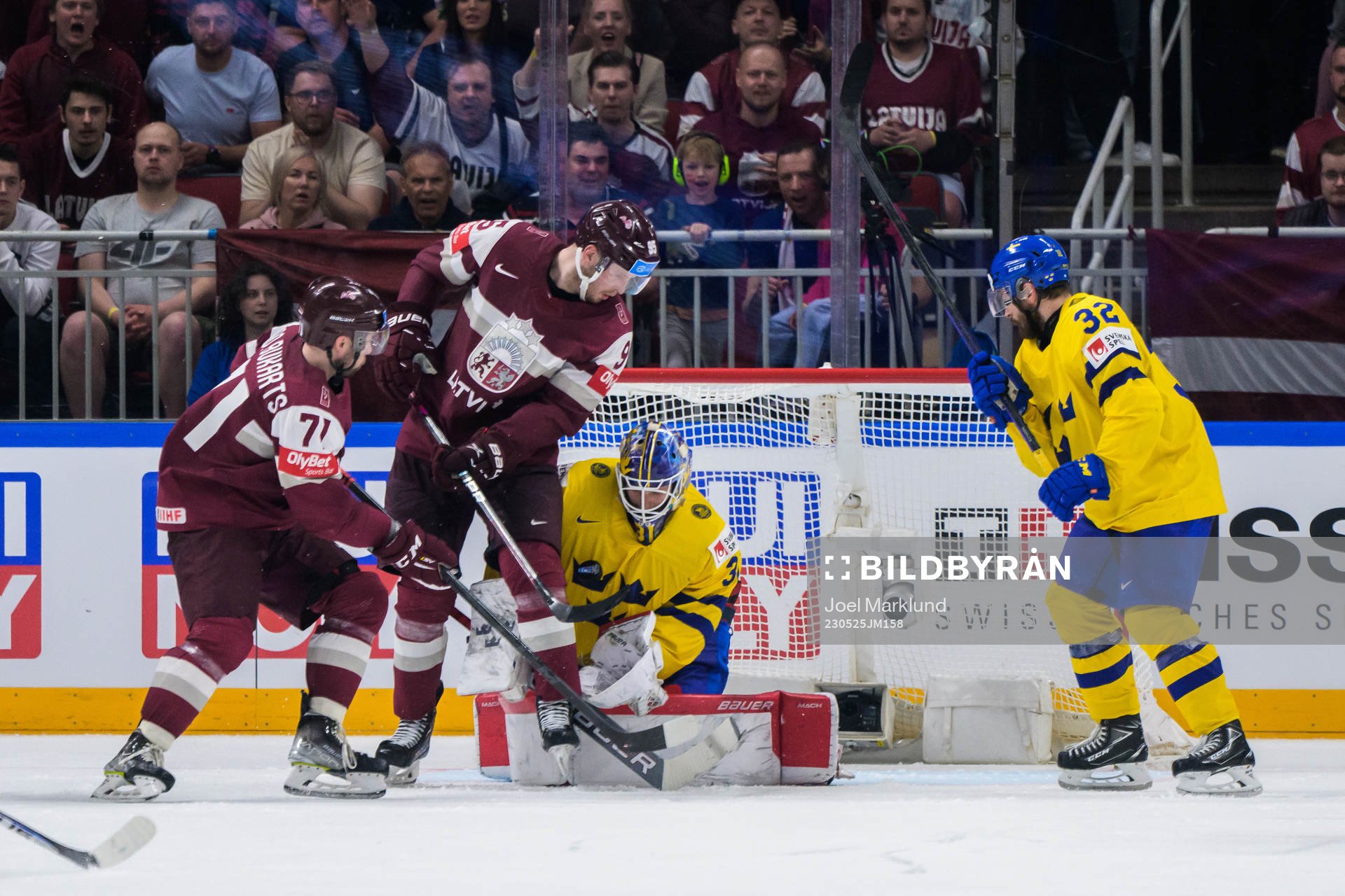 Roberts Bukarts and Oskars Batna of Latvia next to
