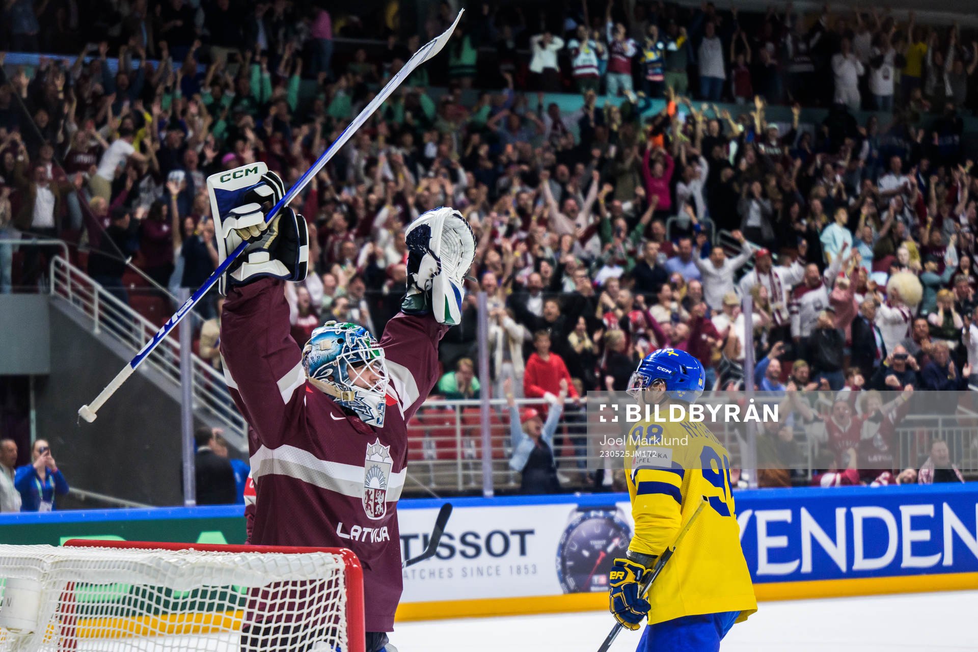 goaltender Arturs Silovs of Latvia celebrates as Alexander