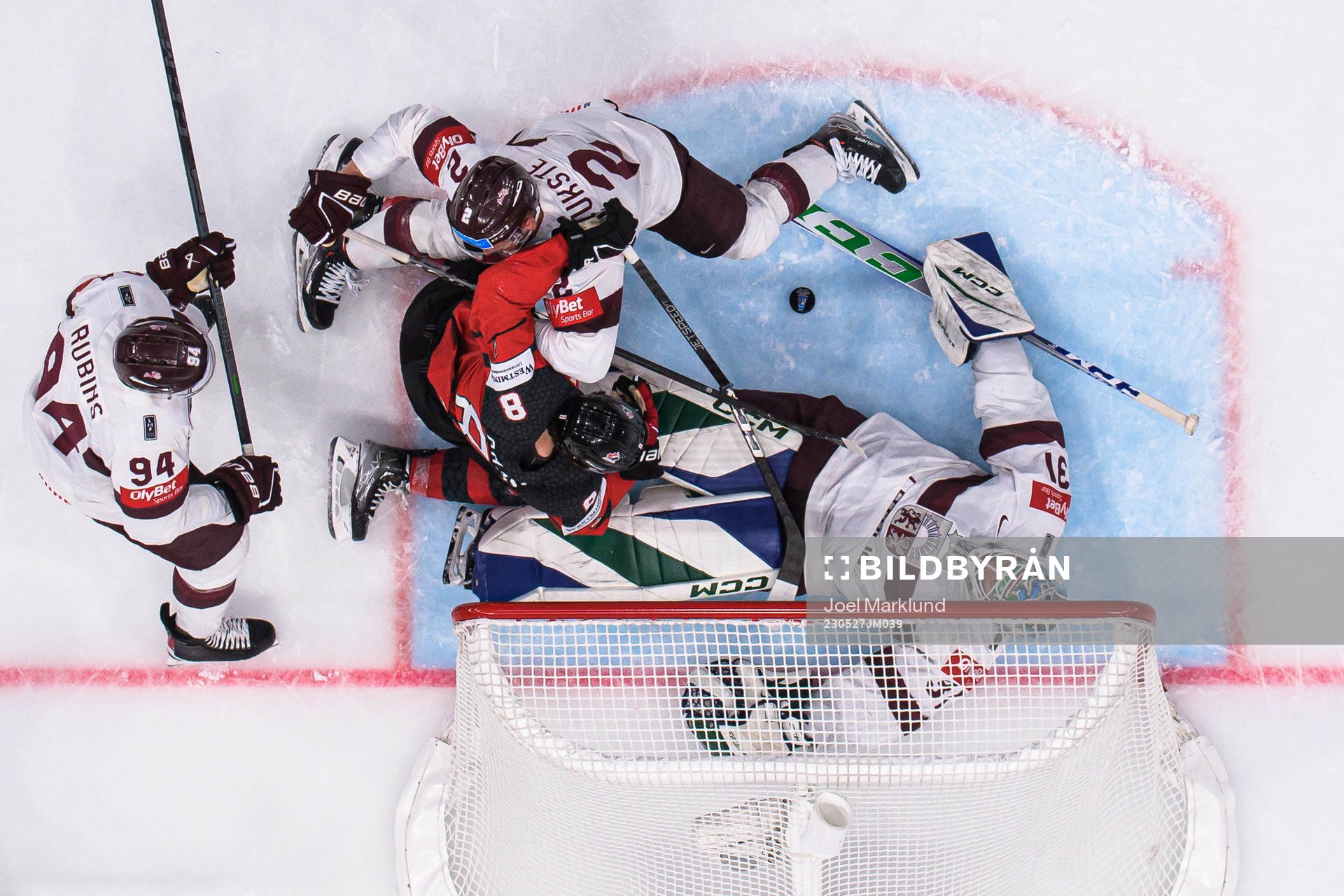 Cody Glass of Canada challenges Kristians Rubins, Karlis