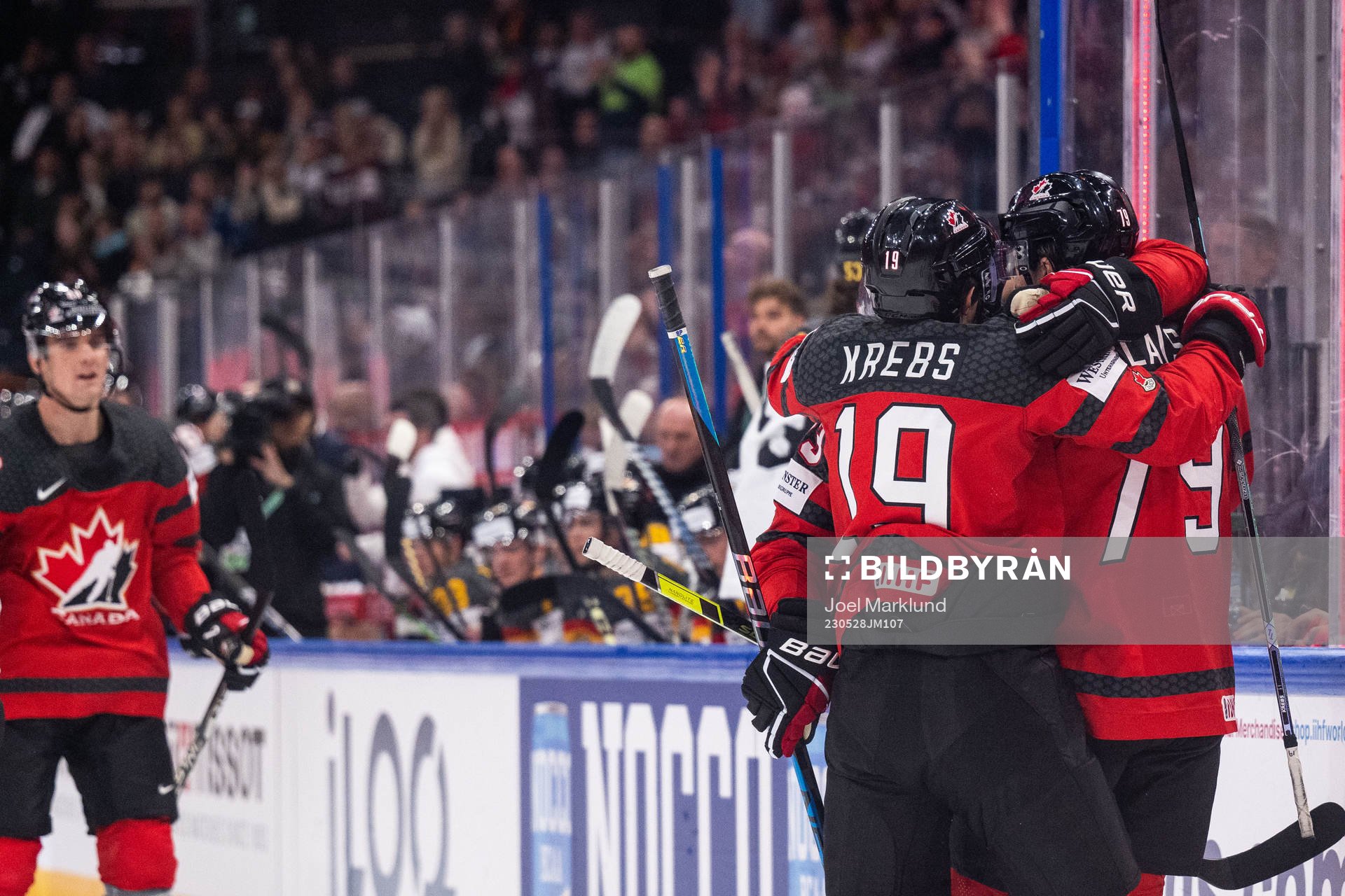 Peyton Krebs and Samuel Blais of Canada celebrate scoring