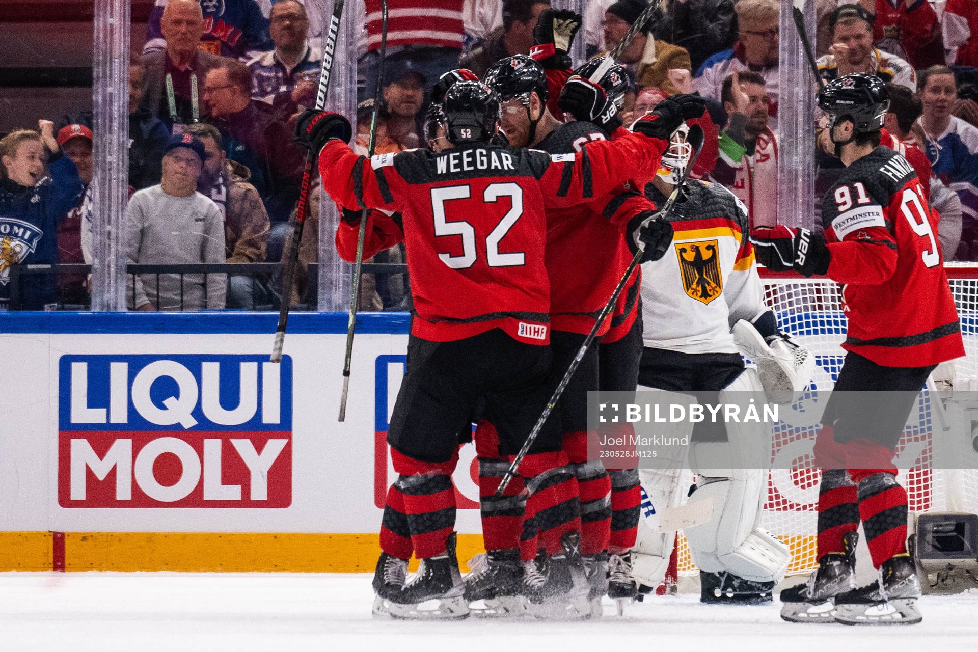 MacKenzie Weegar, Lawson Crouse and Adam Fantilli of Canada