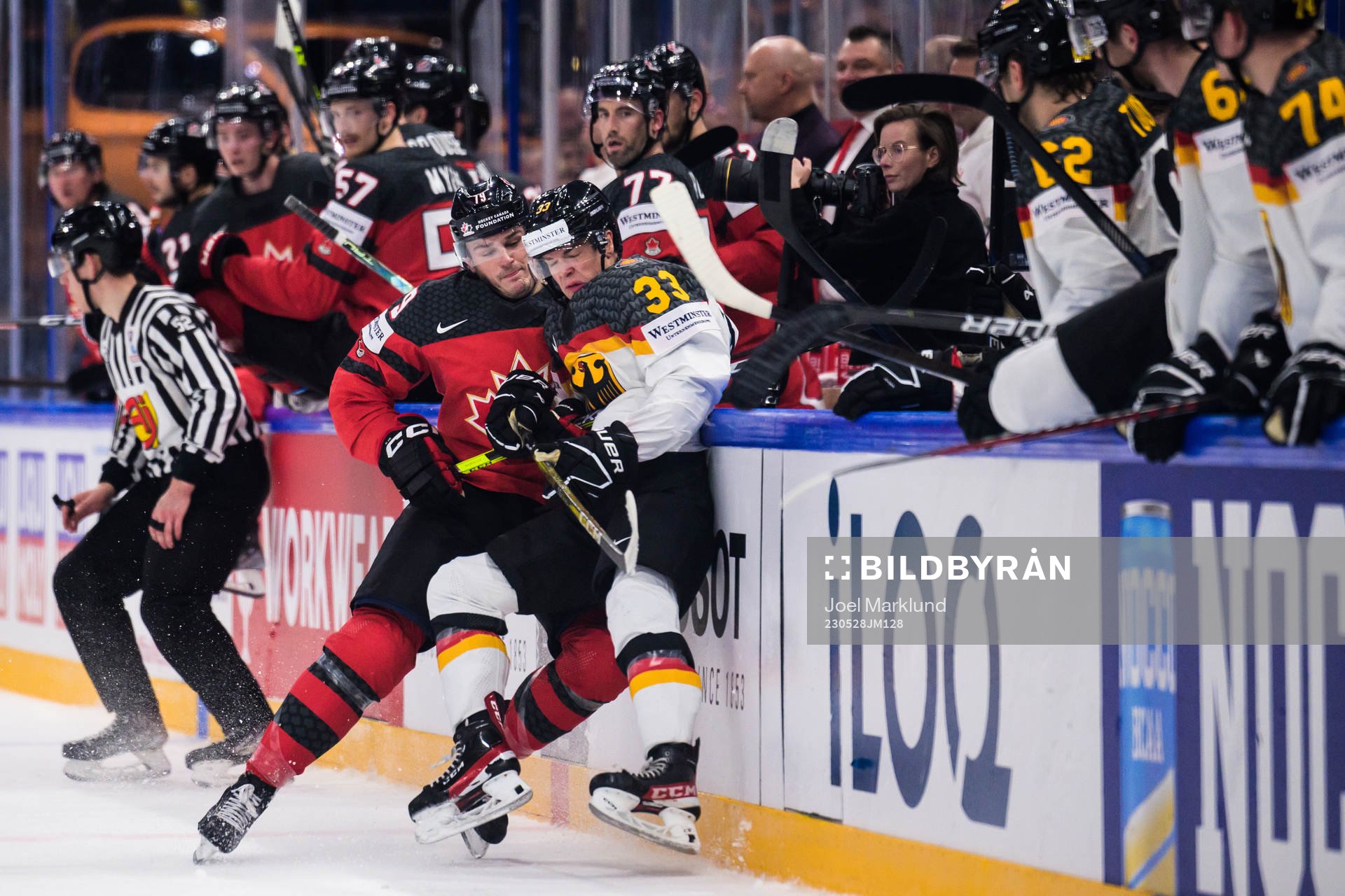 Samuel Blais of Canada tackles John Peterka of Germany