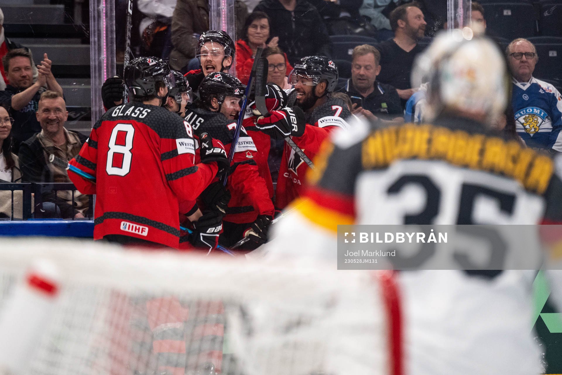 Samuel Blais of Canada celebrates with teammates