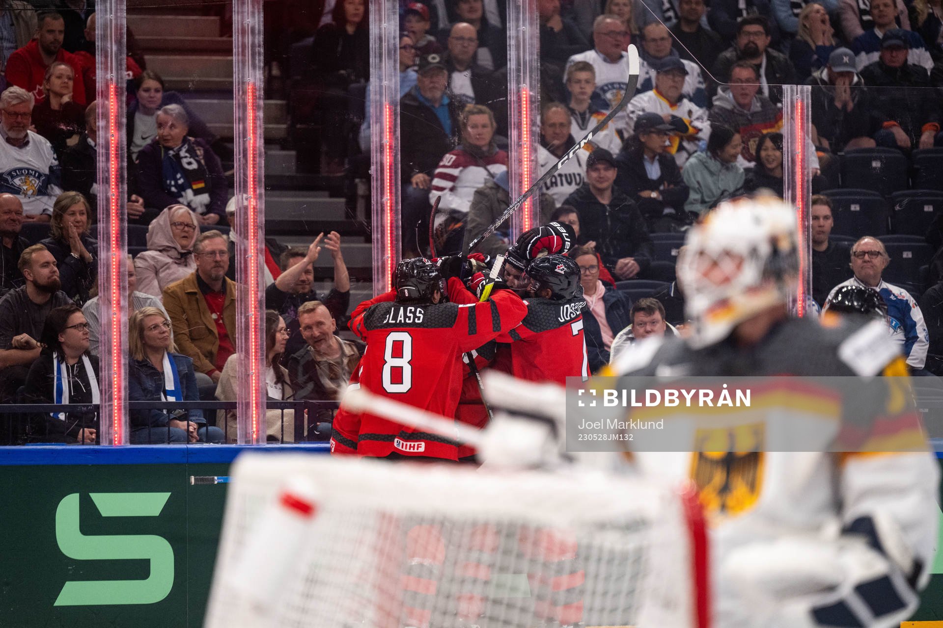 Samuel Blais of Canada celebrates with teammates