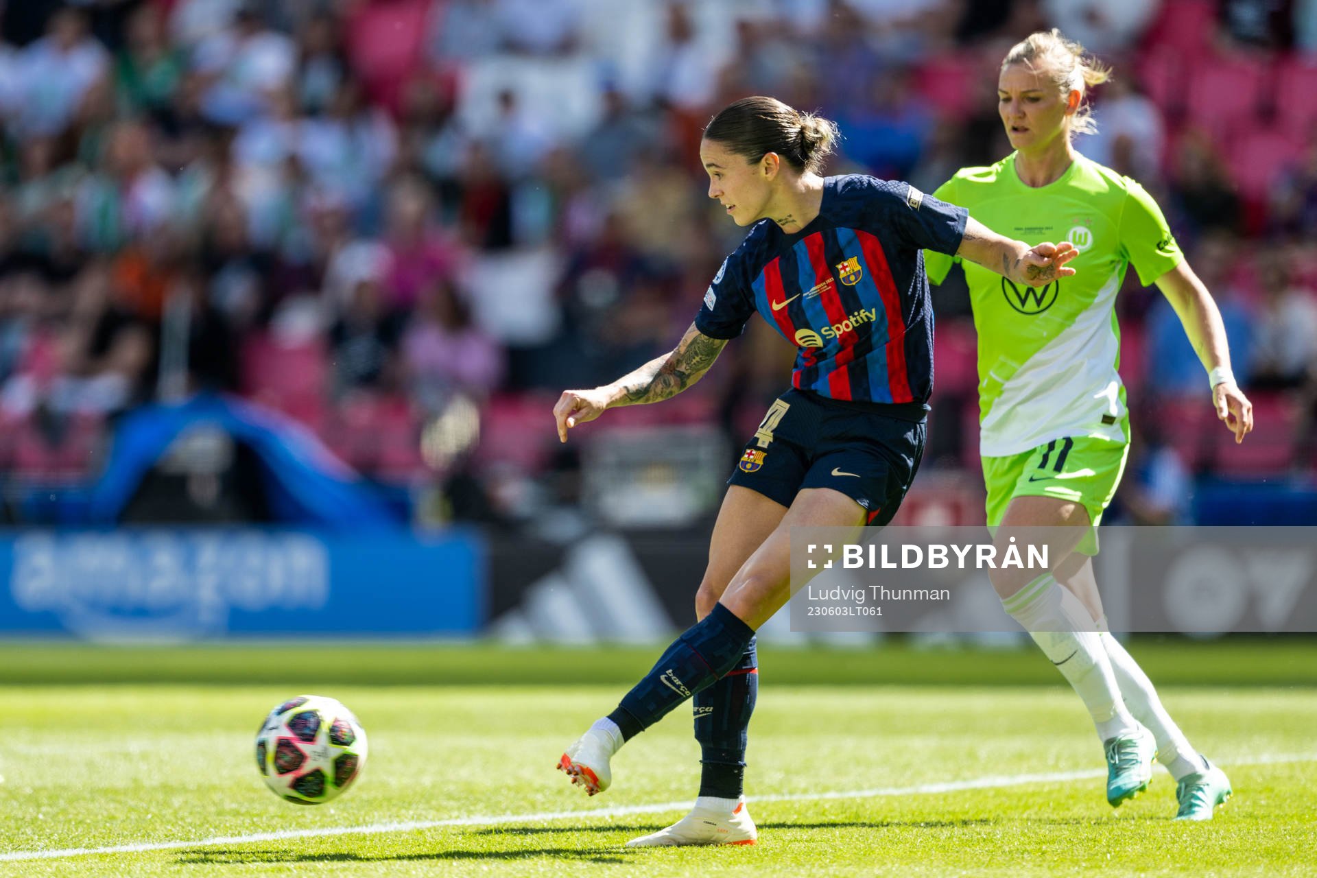 Mapi Leon of Barcelona and Alexandra Popp of Wolfsburg