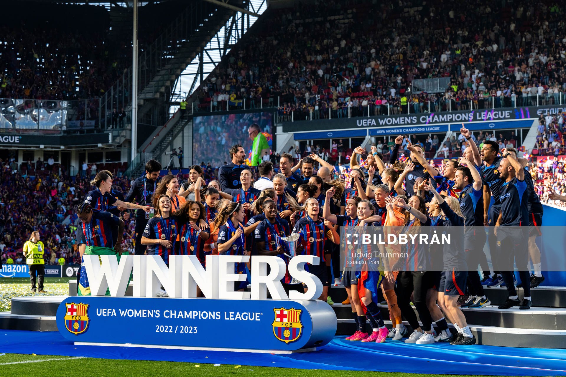 Players of Barcelona celebrate with the trophy