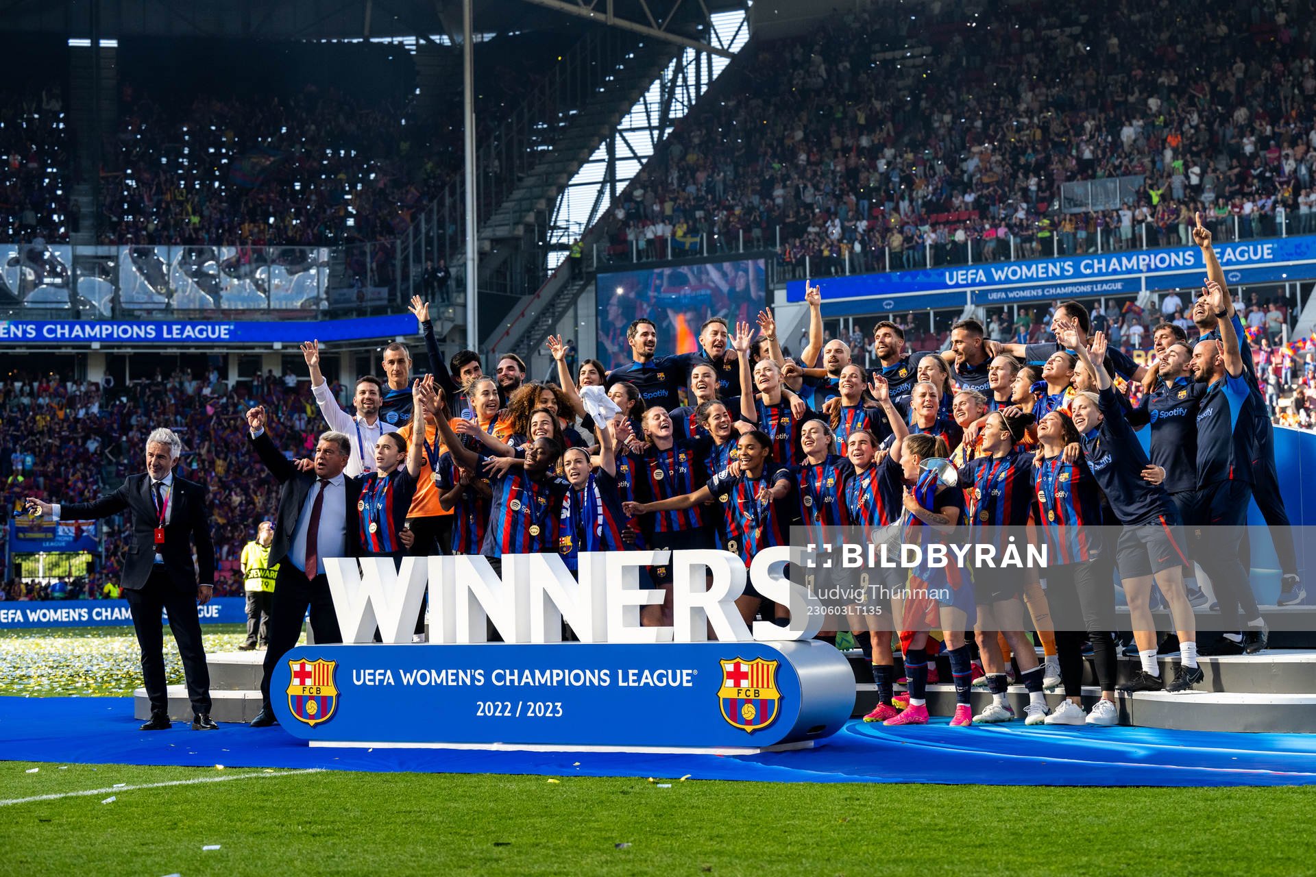 Players of Barcelona celebrate with the trophy