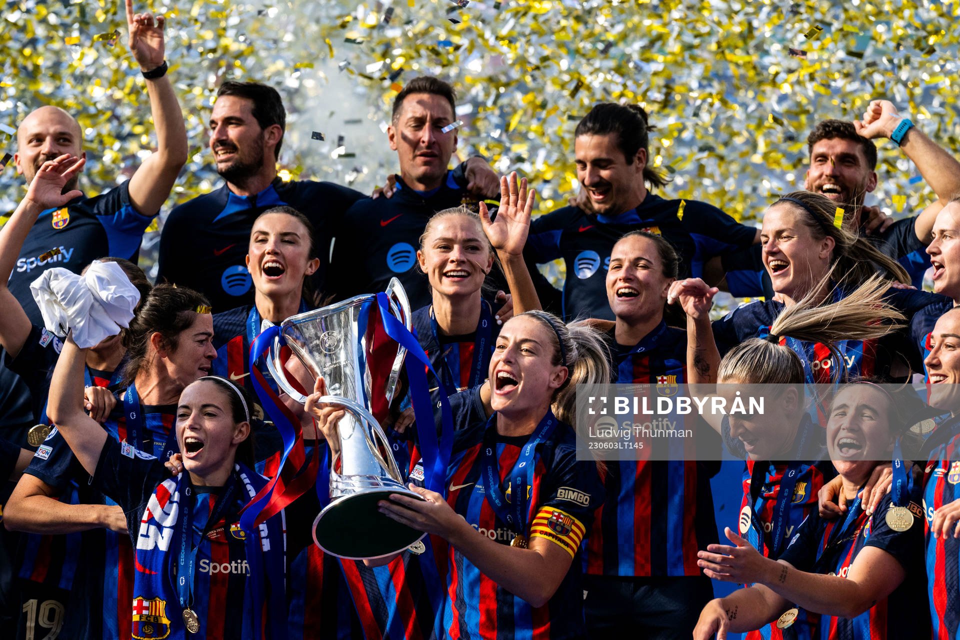 Players of Barcelona celebrate with the trophy