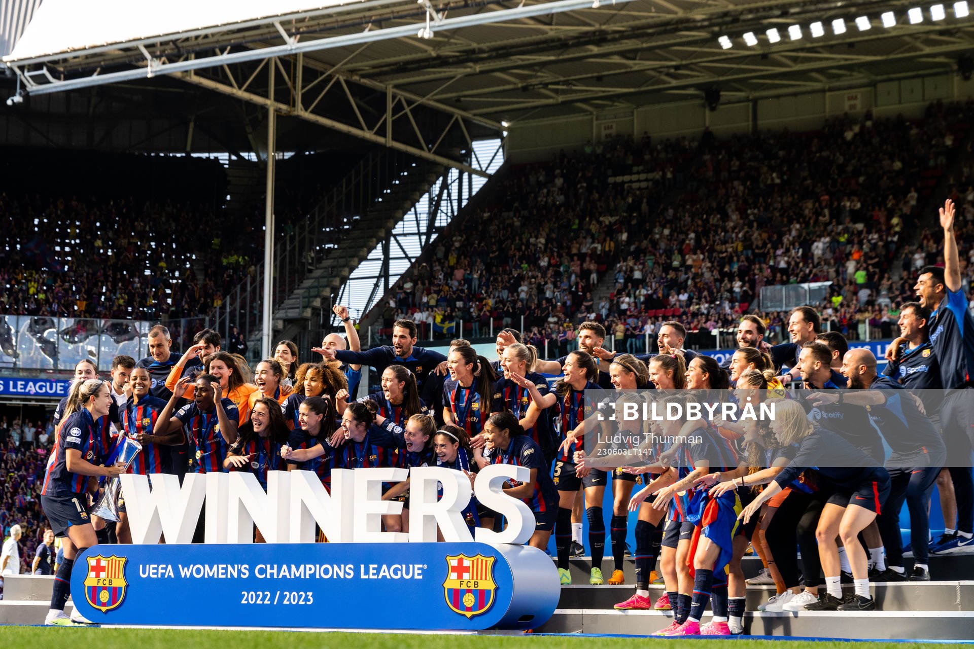Players of Barcelona celebrate with the trophy