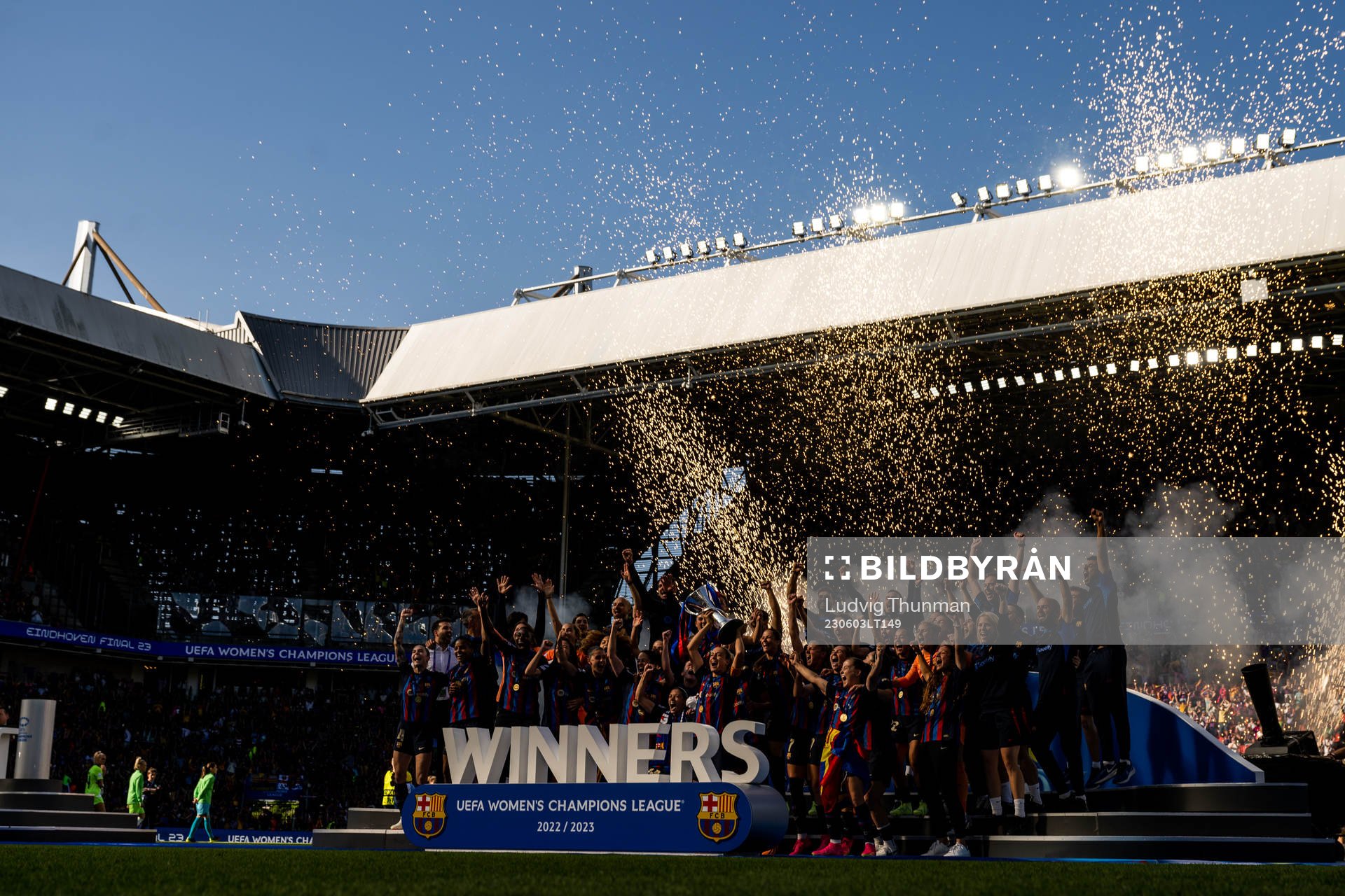 Players of Barcelona celebrate with the trophy