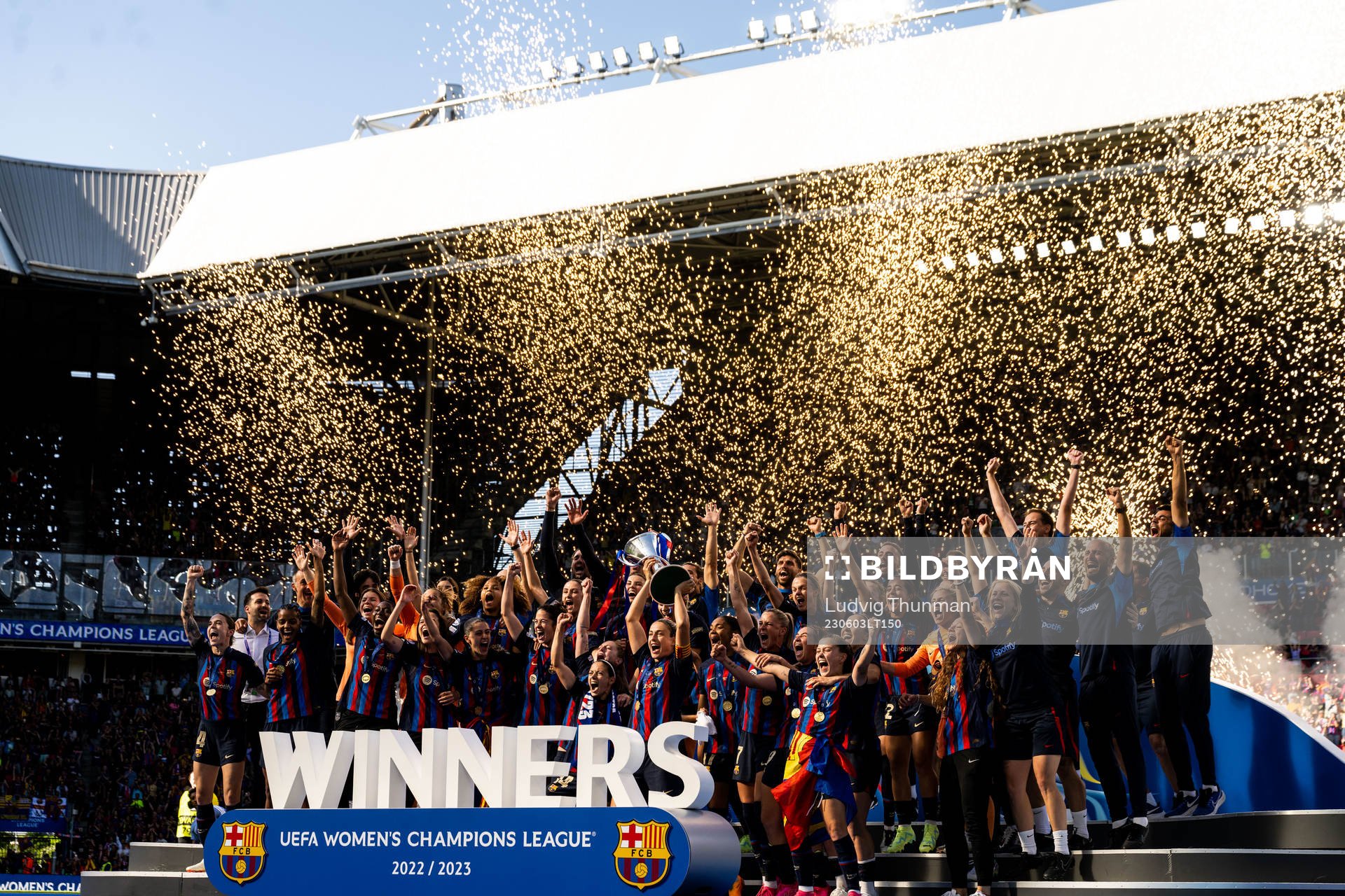 Players of Barcelona celebrate with the trophy