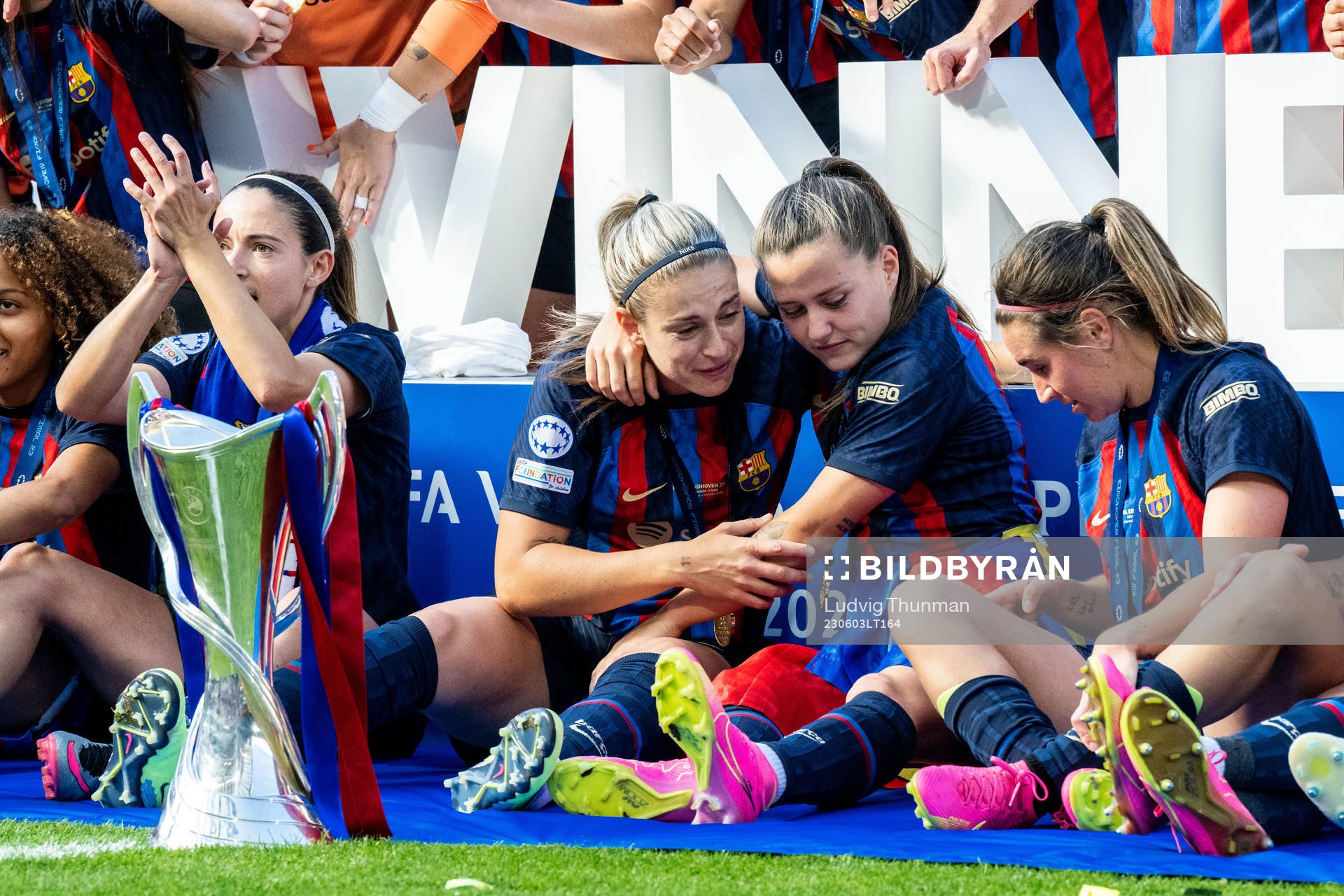 Players of Barcelona celebrate with the trophy
