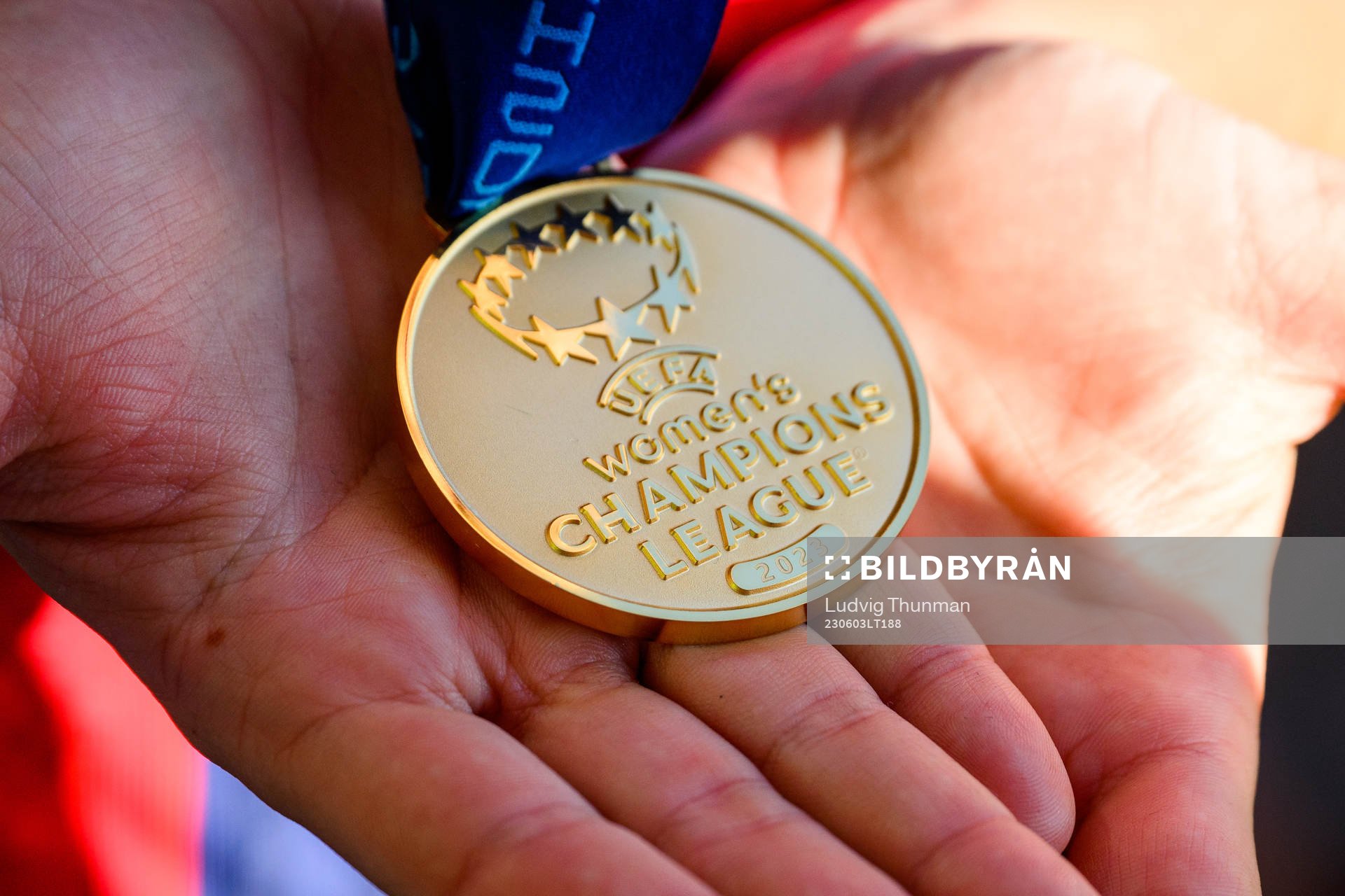 A UEFA Women's Champions League gold medal in the hands of
