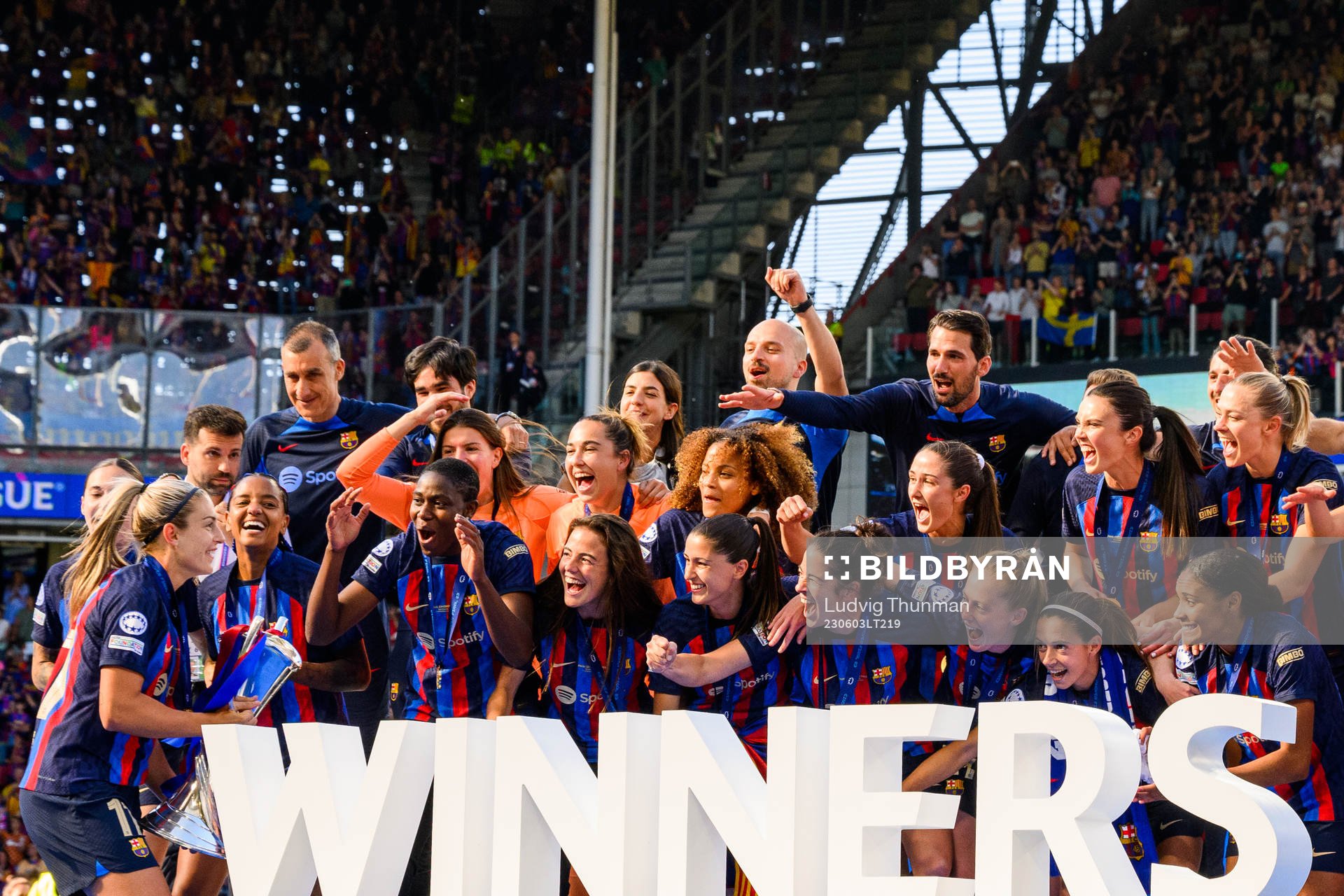 Players of Barcelona lift the trophy