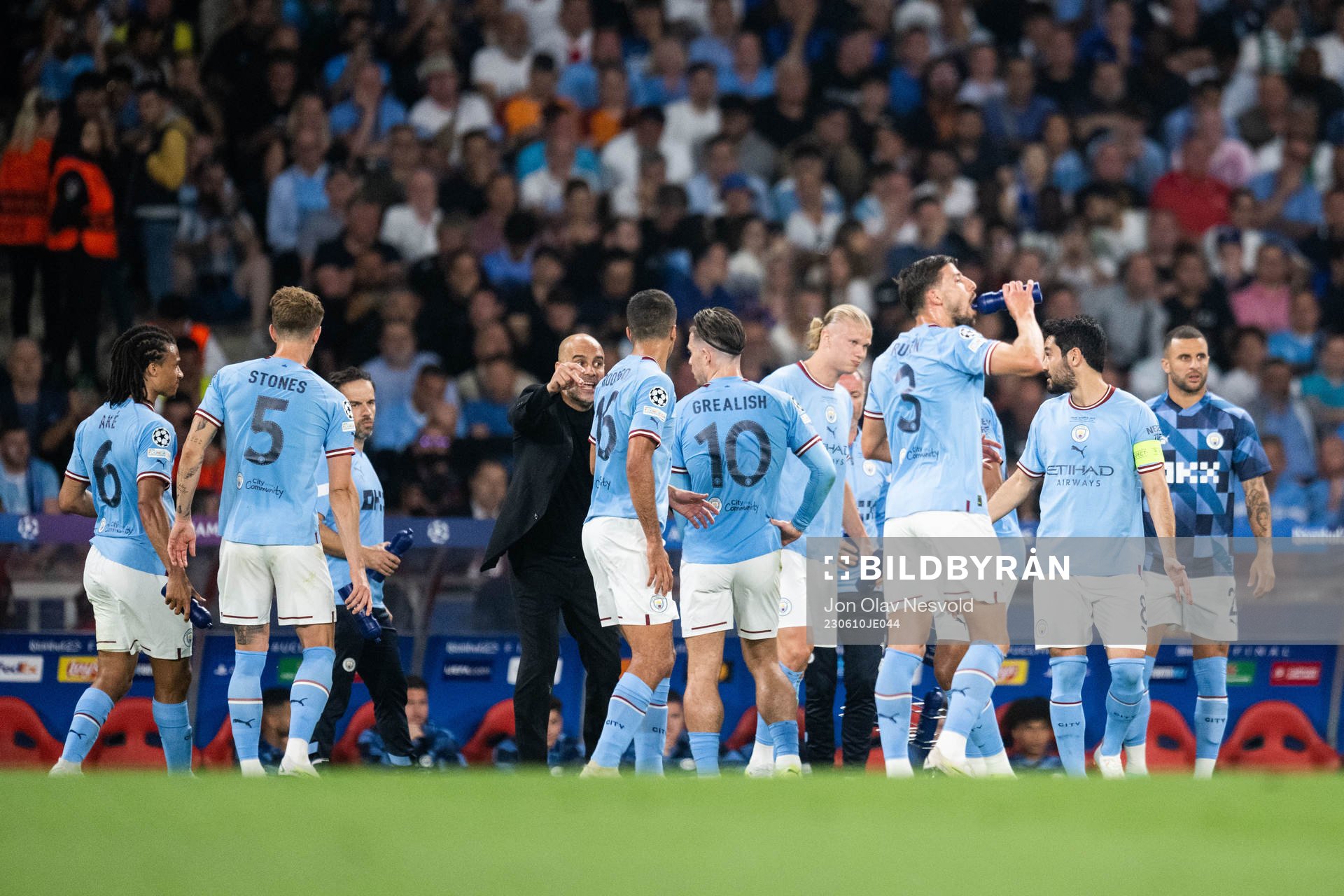 Head coach Pep Guardiola and Erling Braut Haaland of