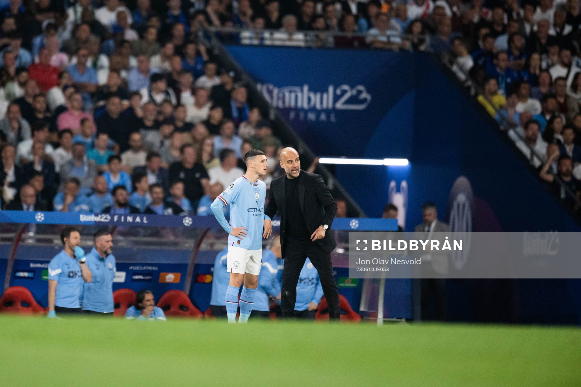 Phil Foden and Head coach Pep Guardiola of Manchester City