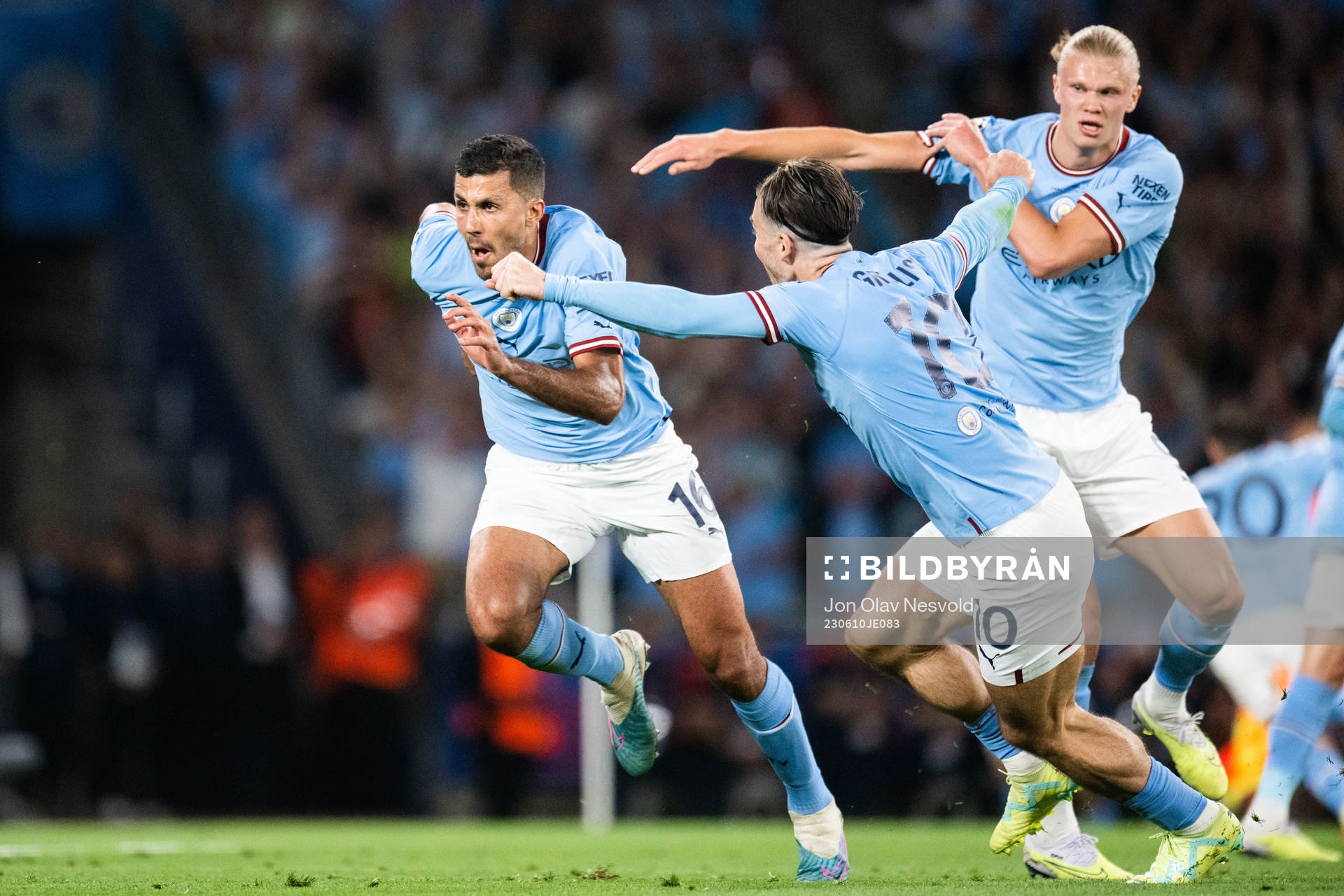 Rodri of Manchester City celebrates with Jack Grealish and