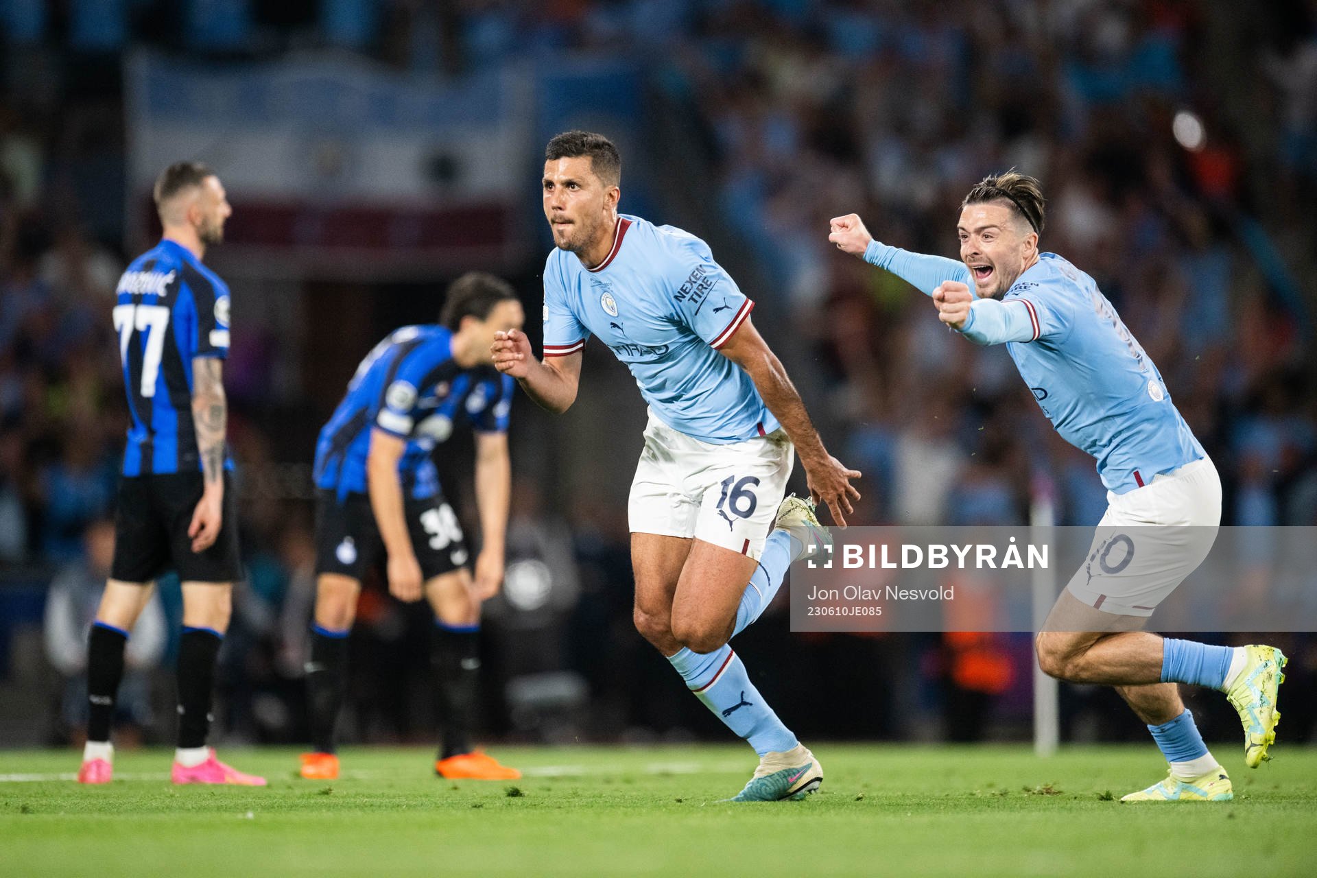 Rodri of Manchester City celebrates with Jack Grealish