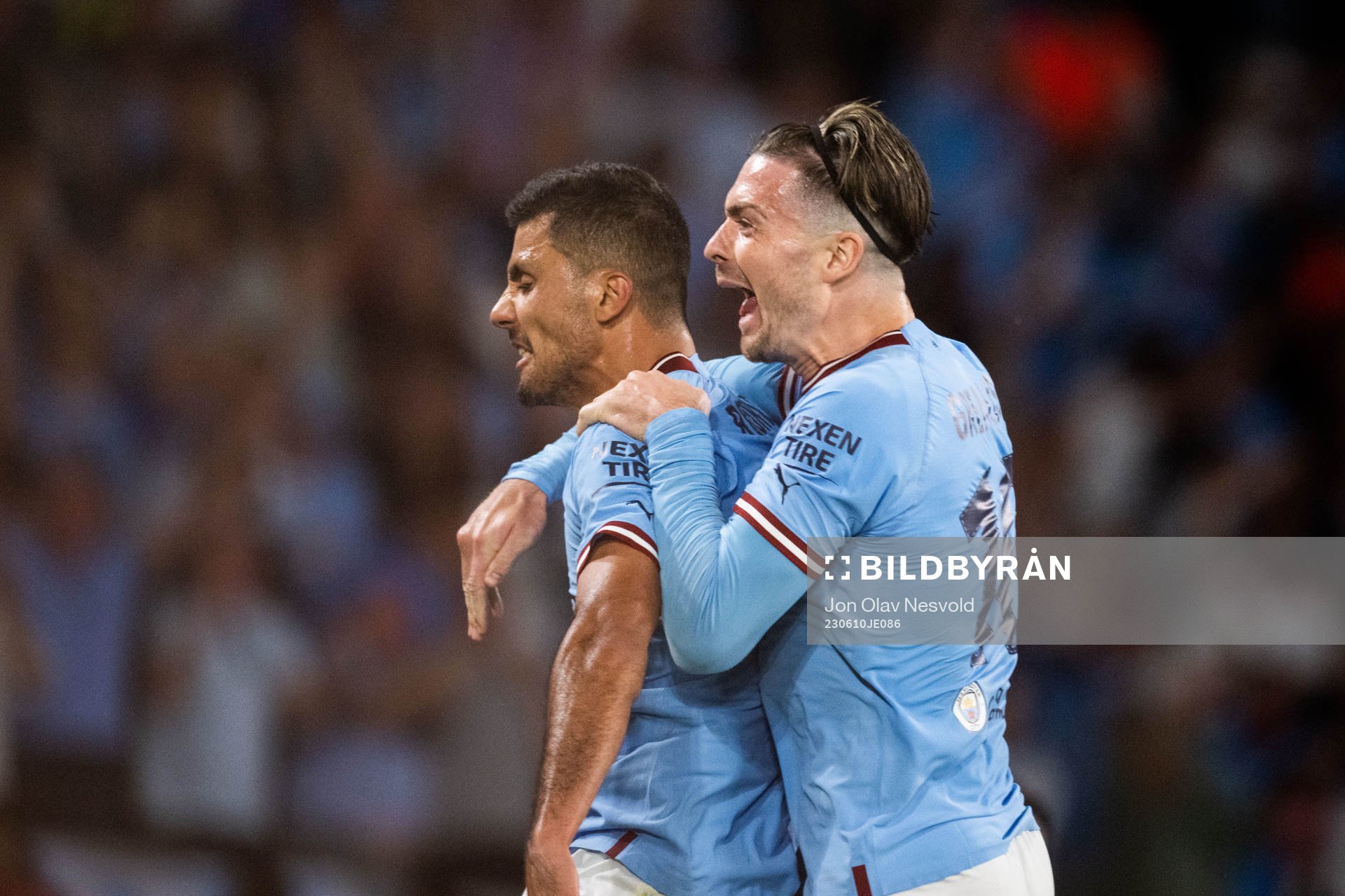 Rodri of Manchester City celebrates with Jack Grealish
