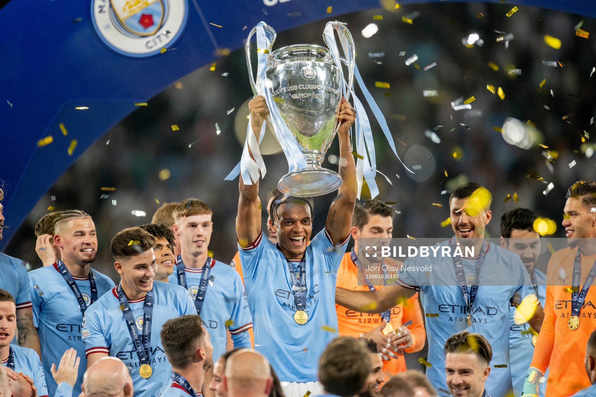 Players of Manchester City celebrate with the trophy