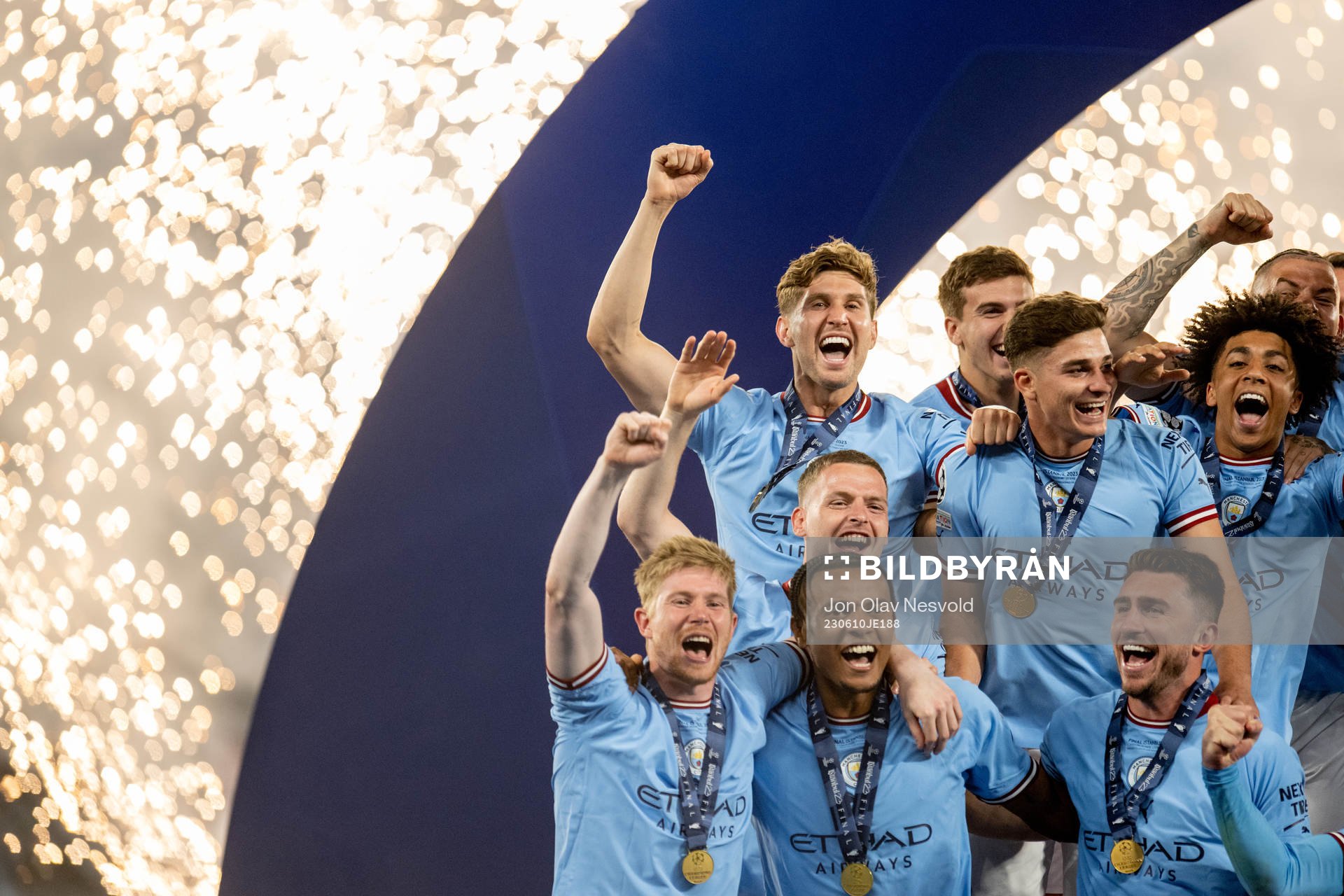 Players of Manchester City celebrate with the trophy