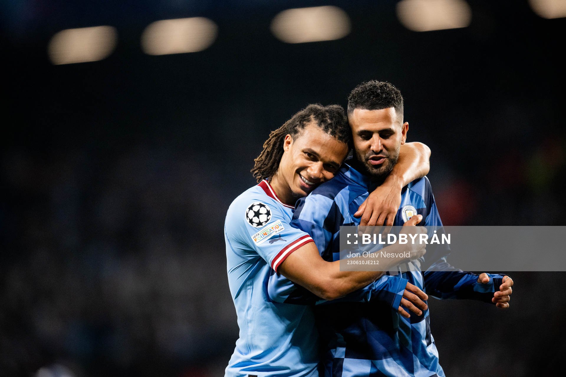Nathan Ake and Riyad Mahrez of Manchester City